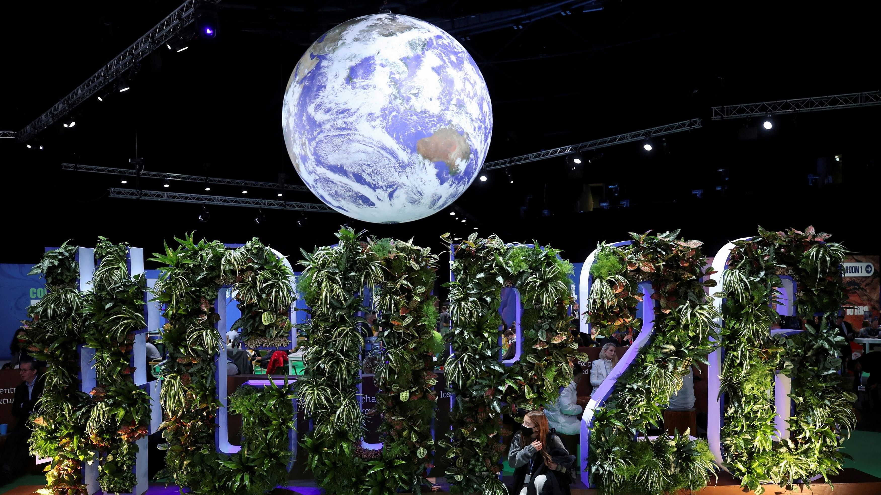 FILE PHOTO: A giant model of earth is seen in a meeting hall during the UN Climate Change Conference  in Glasgow, Scotland, Britain, November 2, 2021.  REUTERS/Yves Herman/File Photo