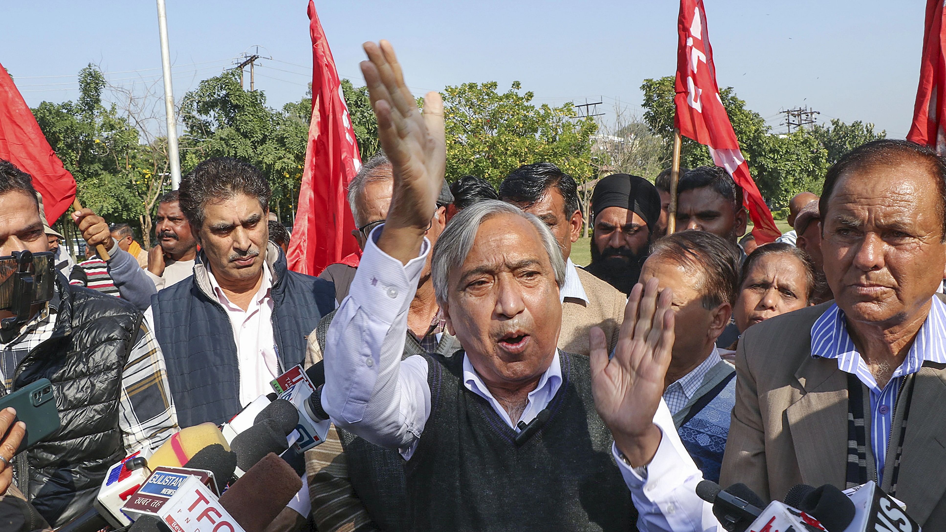 <div class="paragraphs"><p>Centre of Indian Trade Unions (CITU) state president and CPI(M) leader Mohammad Yousuf Tarigami with workers shout slogans during a protest, in Jammu, Tuesday, Nov. 28, 2023. </p></div>