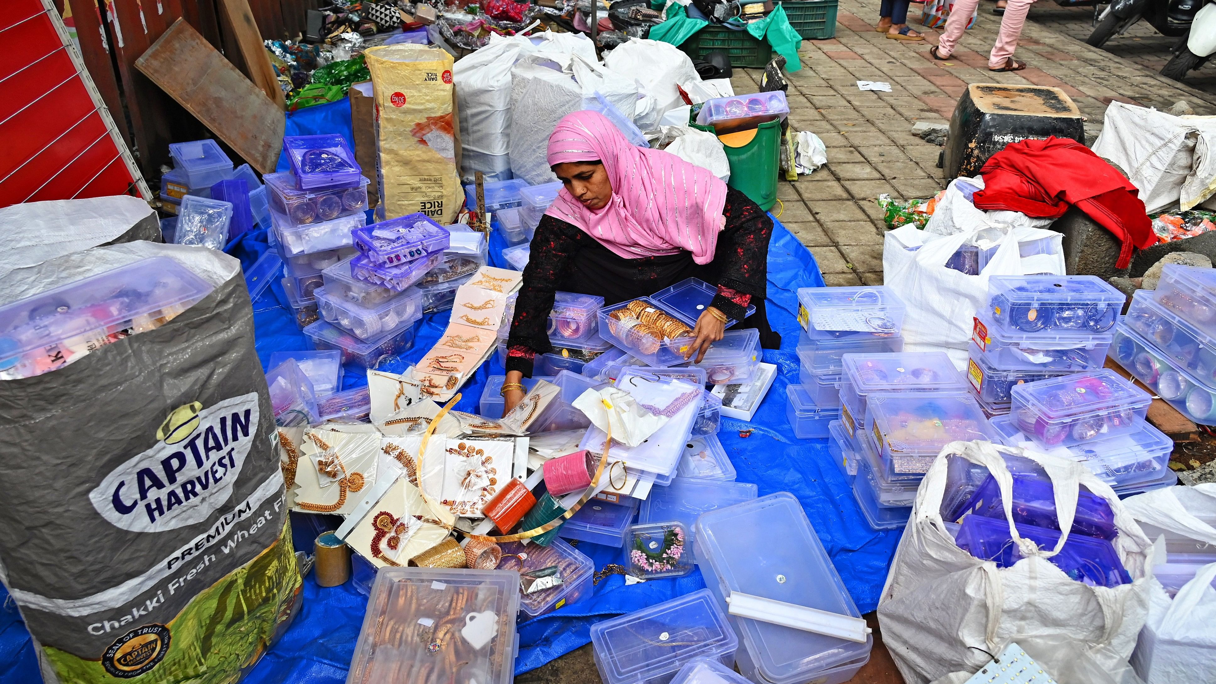 Maimun Khatoon, an artificial jewellery vendor, was left to salvage her merchandise from the debris after the BBMP demolished her kiosk.