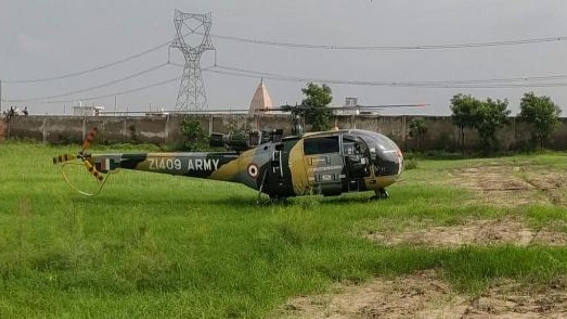 <div class="paragraphs"><p>An Indian Army Chetak helicopter makes a precautionary landing near a school, in Mathura. </p></div>