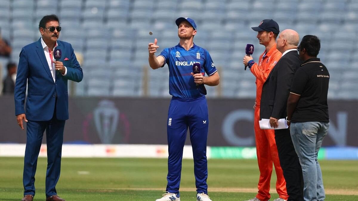 <div class="paragraphs"><p>England's Jos Buttler in action with Netherlands' Scott Edwards during the coin toss.&nbsp;</p></div>