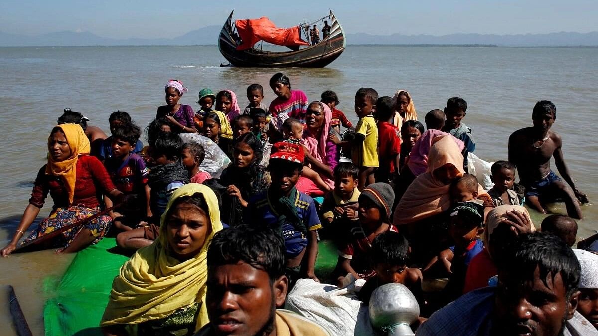 <div class="paragraphs"><p>File photo of Rohingya refugees sitting on a makeshift boat at the&nbsp;Shah Porir Dwip near Cox's Bazar, Bangladesh.&nbsp;</p></div>