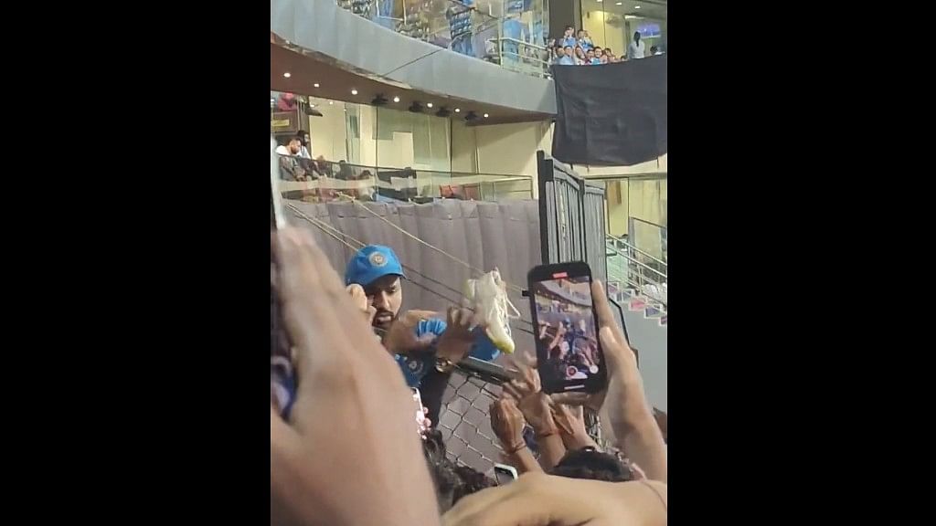 <div class="paragraphs"><p>Rohit&nbsp;Sharma seen giving his shoes to a fan in a video.</p></div>