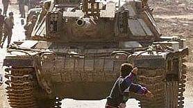 <div class="paragraphs"><p>Cropped image showing Faris Odeh throwing stone on an Israeli tank.</p></div>