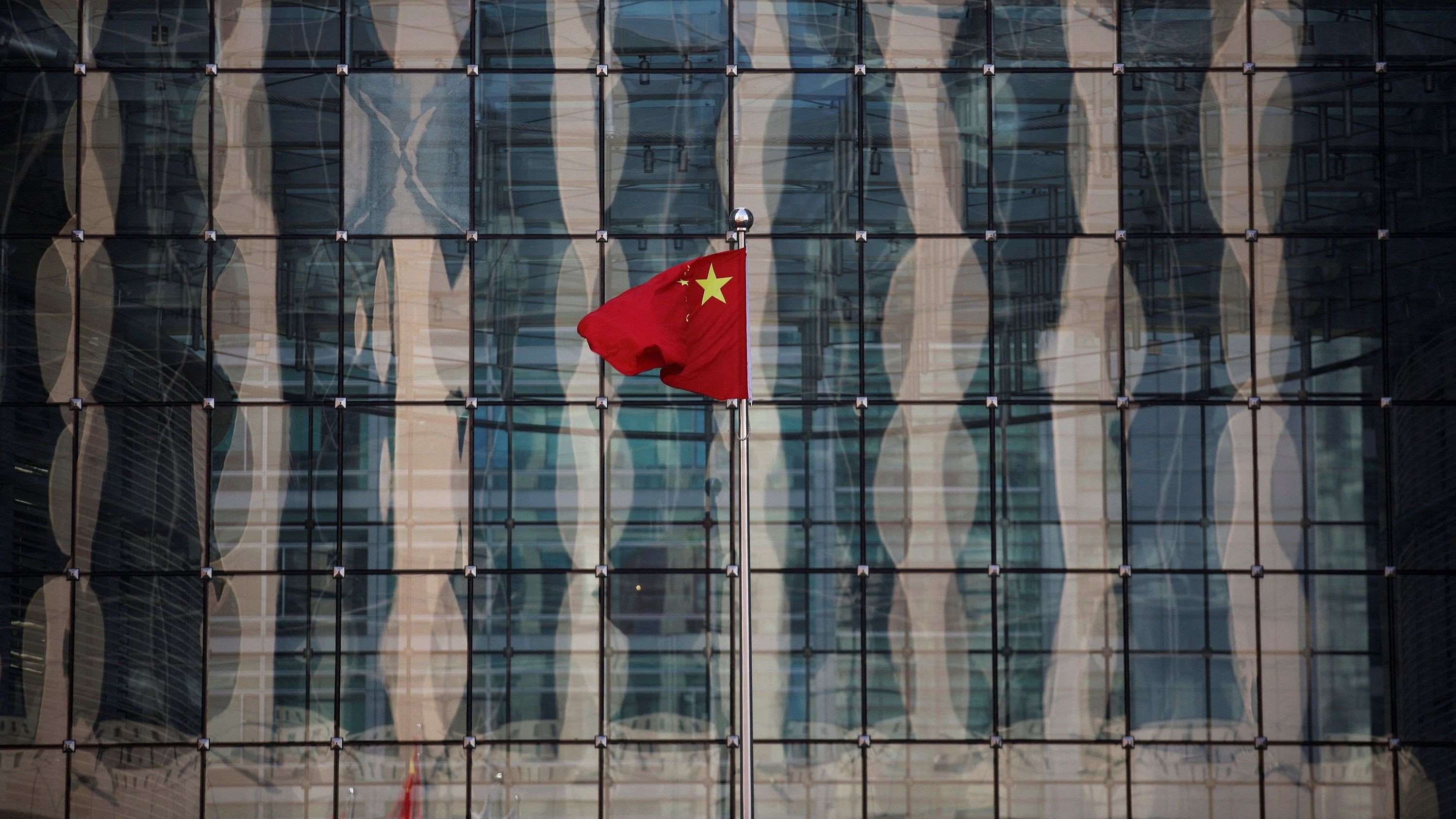 <div class="paragraphs"><p>Since the 1990s, China has emerged as a dominant global lender, disrupting the grip of major powers on global decision-making. In pic,&nbsp;the Chinese flag flutters outside a bank near the headquarters of the People’s Bank of China in central Beijing. </p></div>