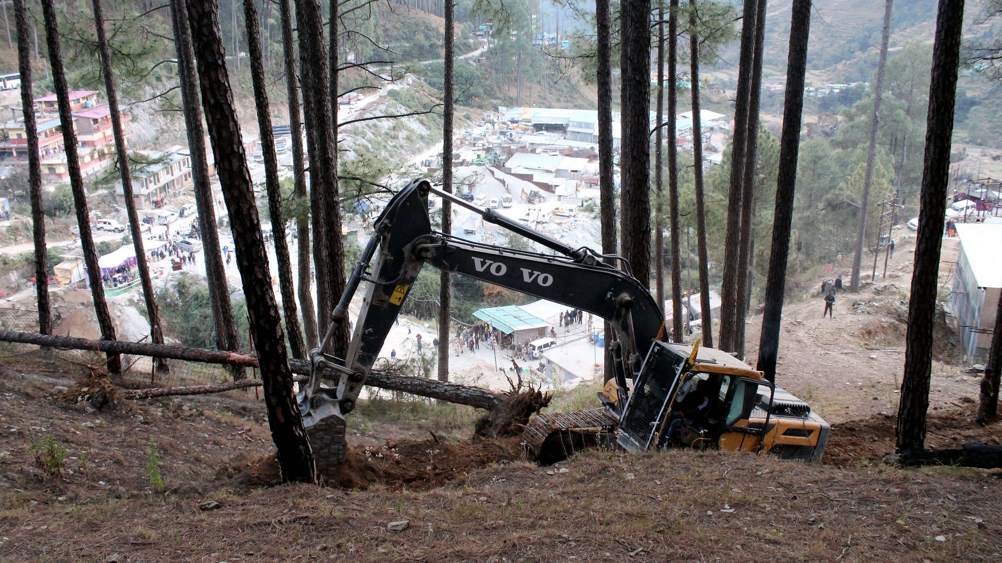 <div class="paragraphs"><p>Uttarkashi: Heavy machinery being used for preparations to drill a vertical hole from the top of the hill under which workers have been trapped inside.</p></div>