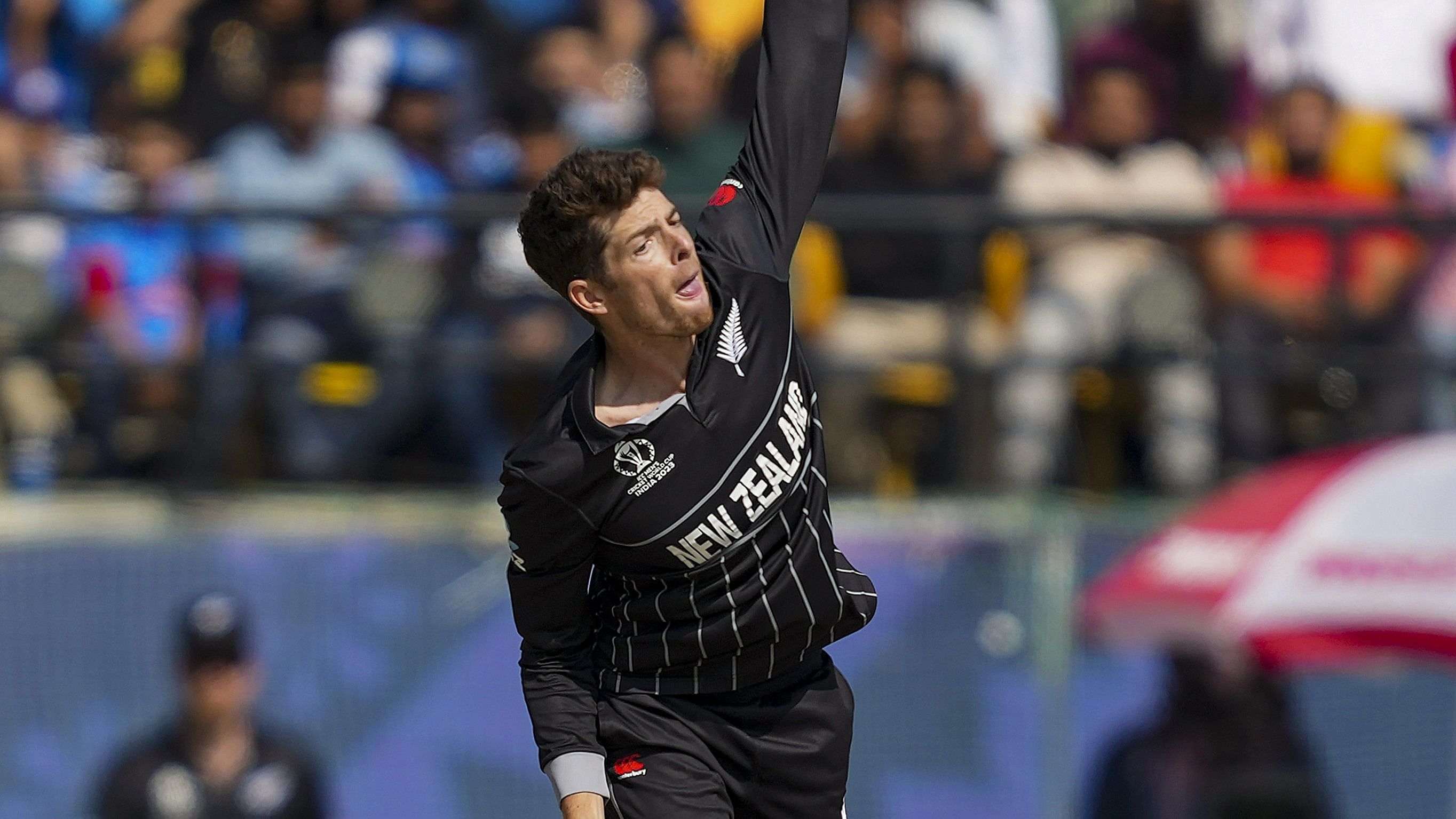 <div class="paragraphs"><p>New Zealand's Mitchell Santner bowls during the ICC Men's Cricket World Cup 2023 match between Australia and New Zealand, at HPCA Stadium, in Dharamshala, Saturday, Oct. 28, 2023. </p></div>