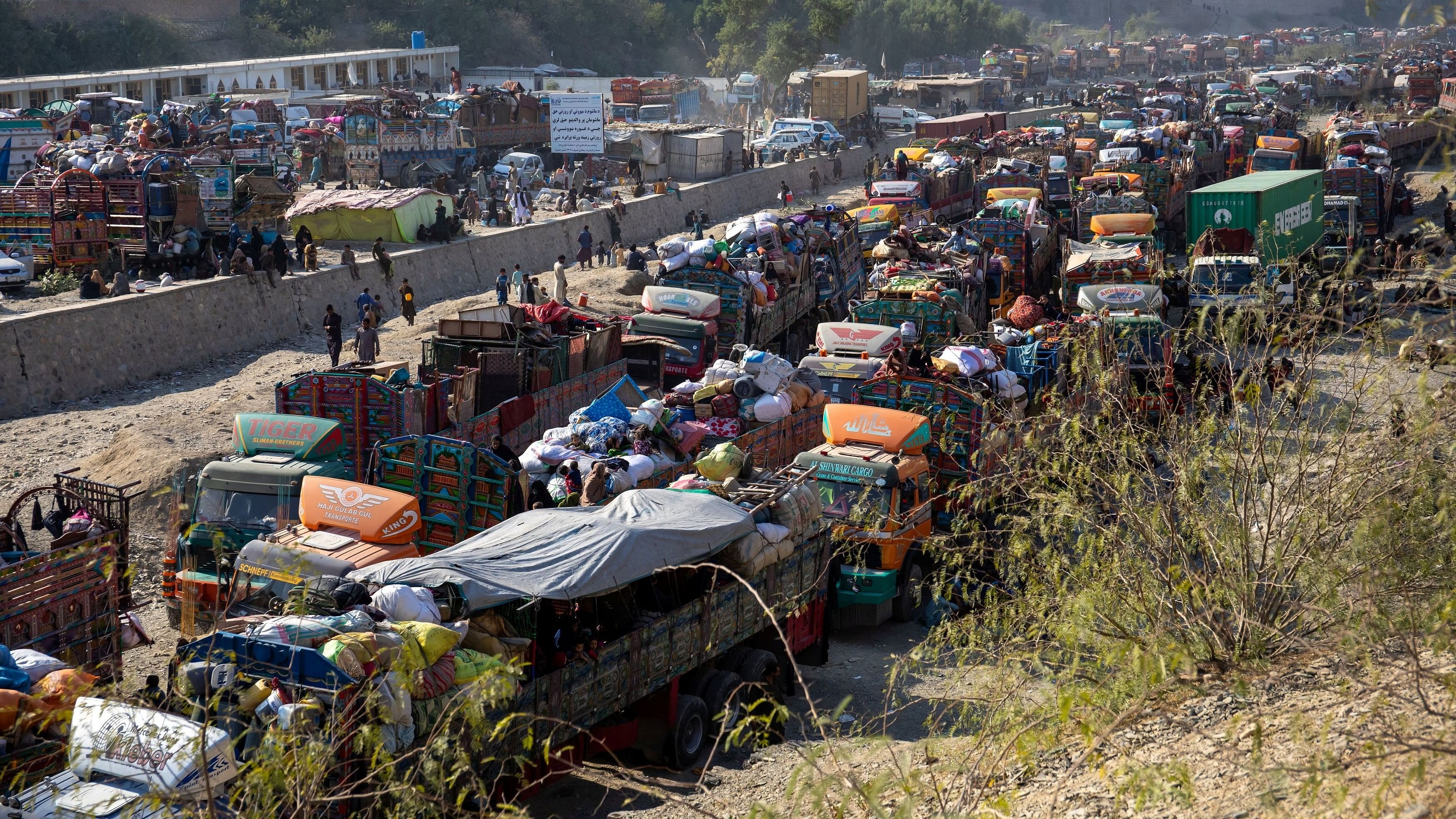 <div class="paragraphs"><p>Trucks loaded with goods are seen as Afghan nationals head back to Afghanistan, at the Torkham border crossing between Pakistan and Afghanistan, October 30, 2023. </p></div>