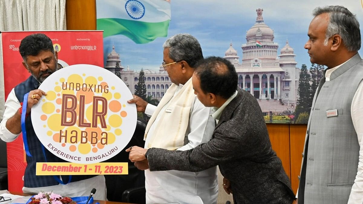 <div class="paragraphs"><p>Chief Minister Siddaramaiah and DCM DK Shivakumar release the book "Unboxing Bangalore and (UBH) "City of New Beginnings" and launch the logo of Bangalore Festival 2023, at CM Home Office Krishna, in Bengaluru. ITBT Minister Priyank Kharge and Co-Founder of Unboxing Bangalore Foundation Prashant Prakash&nbsp; were also seen. </p></div>