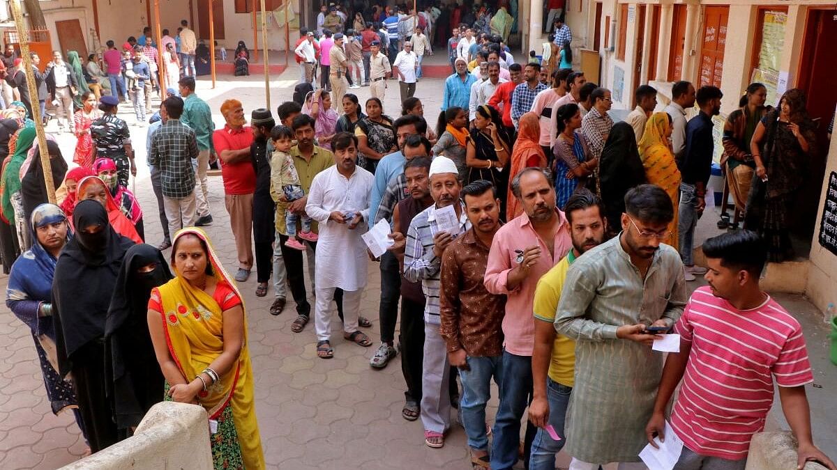 <div class="paragraphs"><p>File photo of people waiting in queues to cast their votes at a polling station during the Madhya Pradesh state assembly election.&nbsp;</p></div>