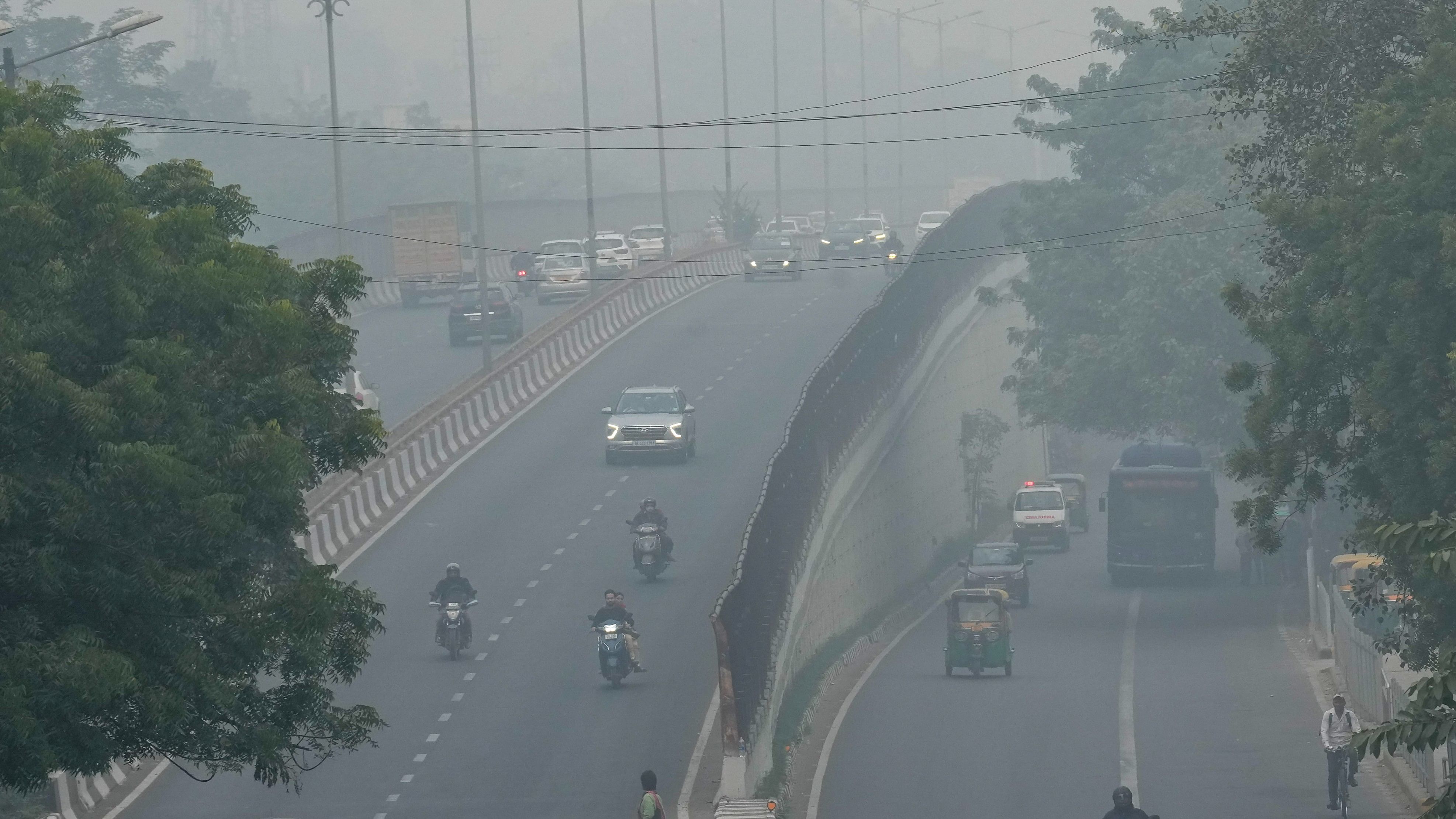 <div class="paragraphs"><p>Vehicles move on a road amid smog, in New Delhi.&nbsp;</p></div>