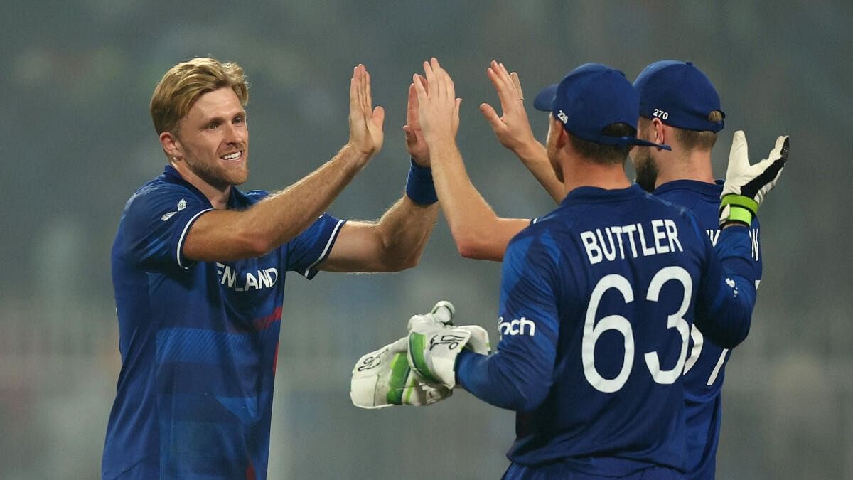 <div class="paragraphs"><p>England's David Willey celebrates with Jos Buttler after taking the wicket of Pakistan's Salman Ali Agha.</p></div>