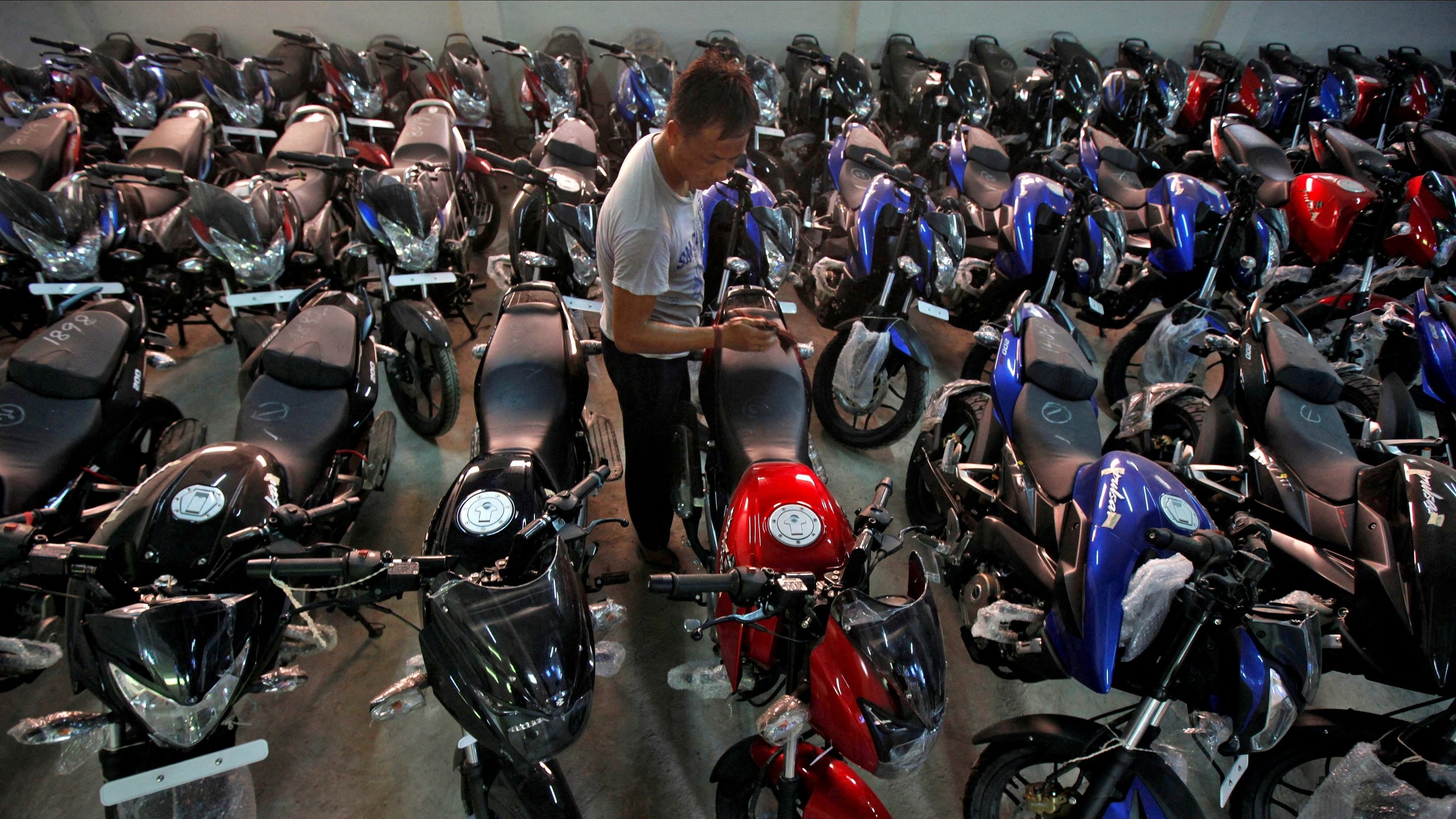 <div class="paragraphs"><p>Motorcycle sales were down in the&nbsp;first half of the current financial year. In pic, a worker cleans a motorcycle at a showroom in Kolkata. </p></div>