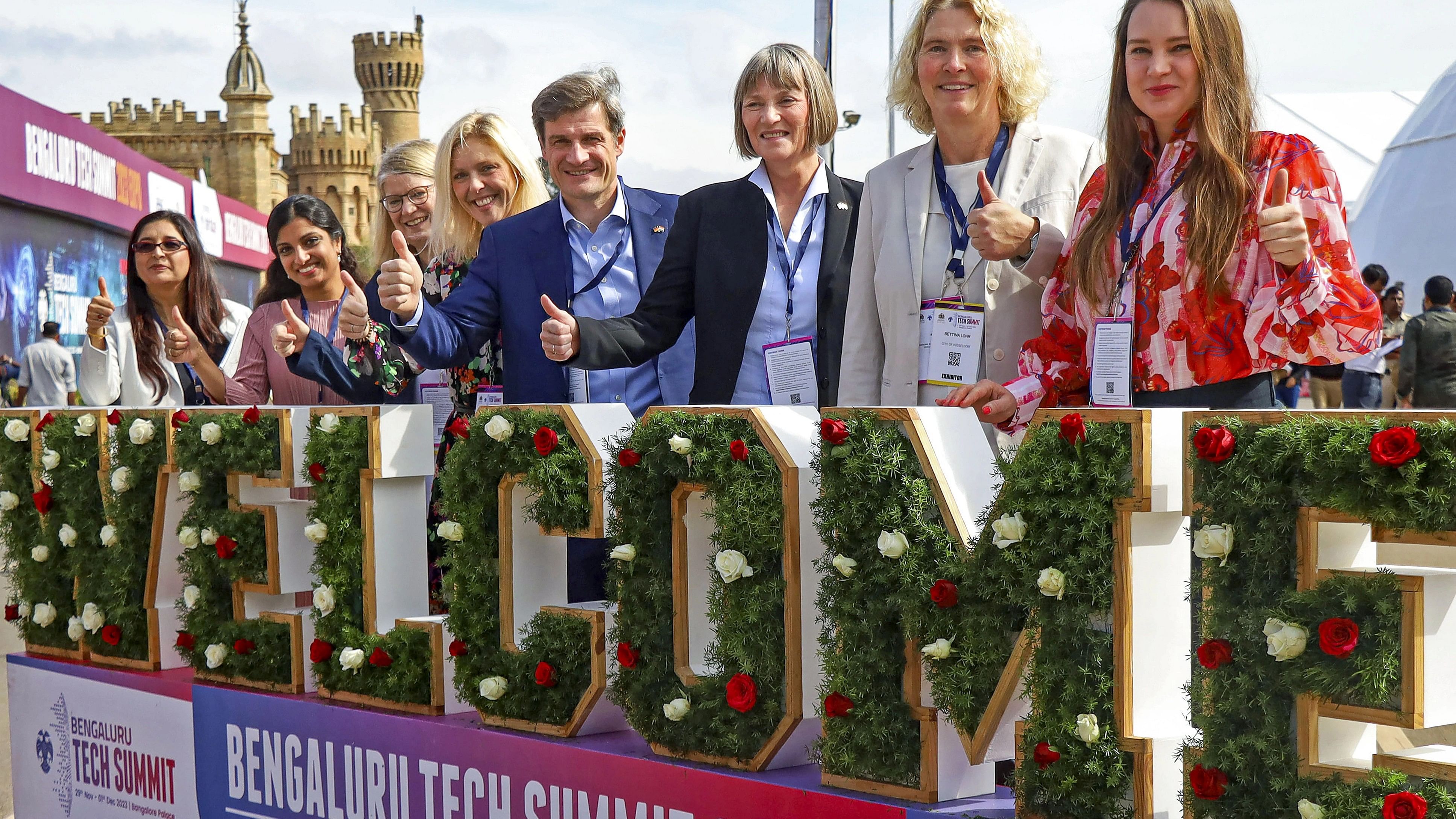 <div class="paragraphs"><p>Foreign delegates pose for photos during the Bengaluru Tech Summit (BTS) 2023, at Bengaluru Palace, in Bengaluru, Wednesday, Nov. 29, 2023.  </p></div>