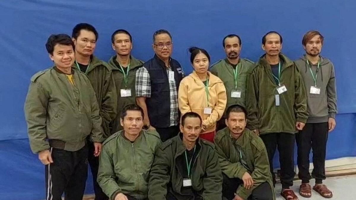 <div class="paragraphs"><p>Thai workers taken hostage by Hamas and later released as part of a deal between Israel and Palestinian Islamist group Hamas, pose with a member of Thai mission after a medical checkup, in Tel Aviv, Israel.</p></div>