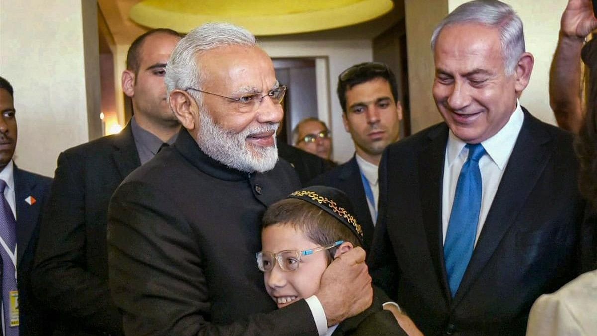 <div class="paragraphs"><p>Prime Minister Narendra Modi hugs 13-year-old Moshe Holtzberg, one of the survivors of the 26/11 Mumbai terror attacks, in Jerusalem, Israel. Holtzberg celebrated his bar mitzvah, a Jewish coming of age ritual for boys.</p></div>