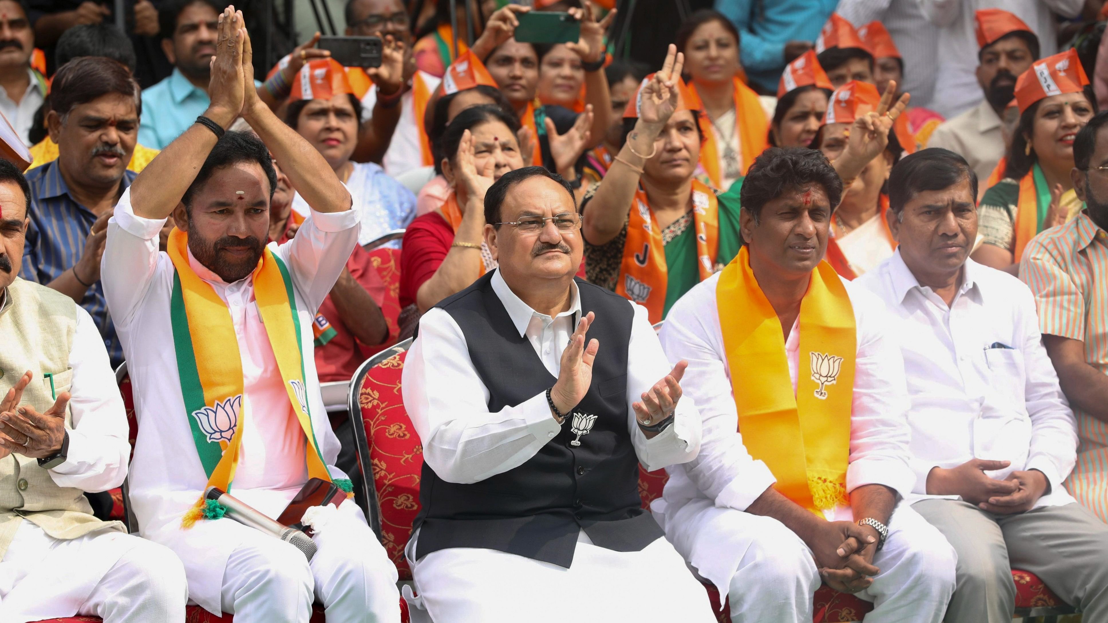 <div class="paragraphs"><p>BJP national president JP Nadda with party's Telangana chief G Kishan Reddy and others listens to the 'Mann Ki Baat', in Hyderabad, Sunday, Nov. 26, 2023.</p></div>