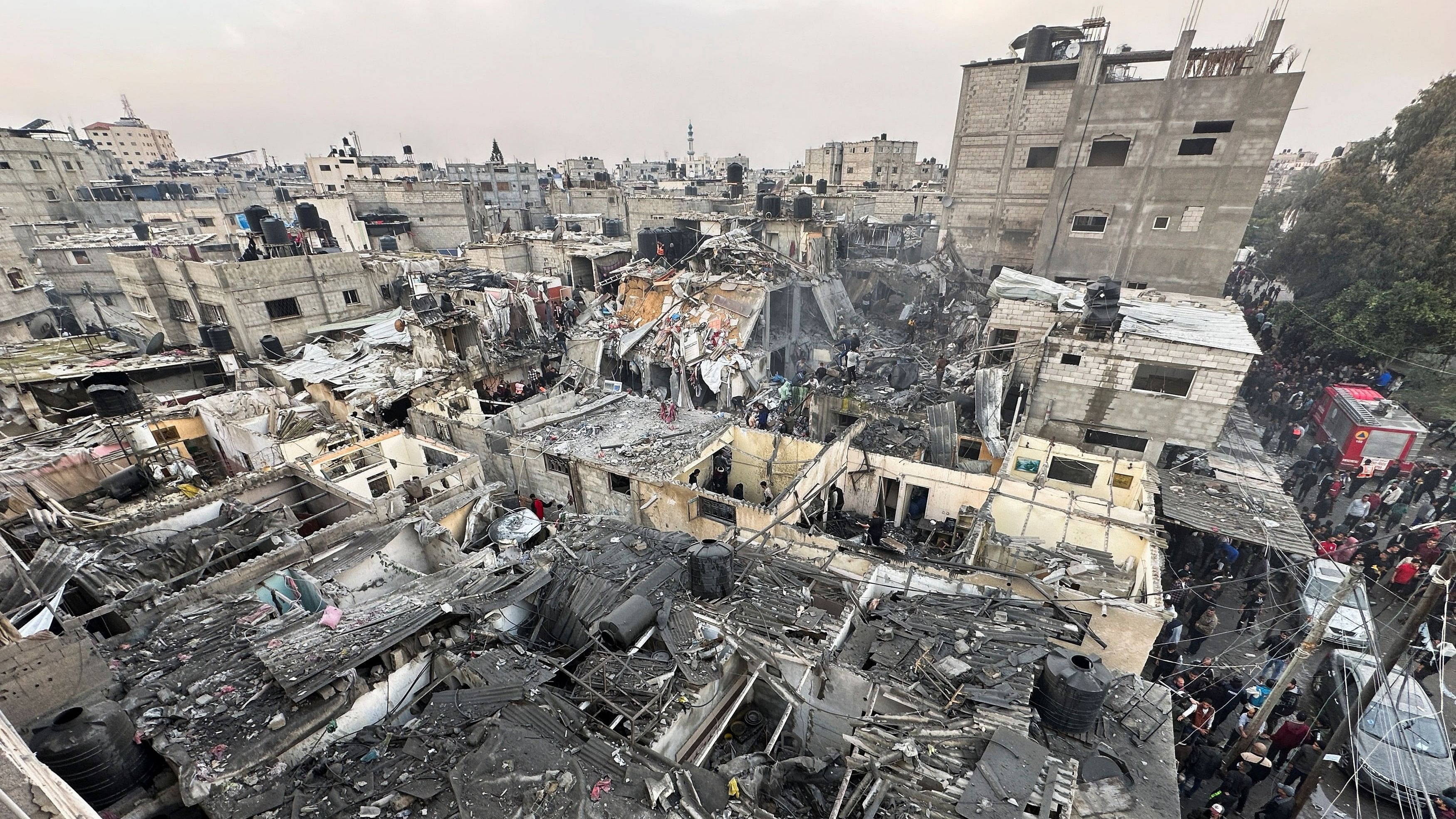 <div class="paragraphs"><p>People search through the rubble of damaged buildings following an Israeli air strike on Palestinian houses, amid the ongoing conflict between Israel and the Palestinian Islamist group Hamas, in Rafah in the southern Gaza Strip December 12, 2023. </p></div>