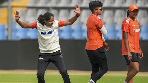 <div class="paragraphs"><p>India's captain Harmanpreet Kaur with teammates Shafali Verma and Titas Sadhu during a practice session ahead of the one-off Test cricket match between India and Australia, at Wankhede Stadium in Mumbai, Wednesday, Dec 20, 2023.</p></div>
