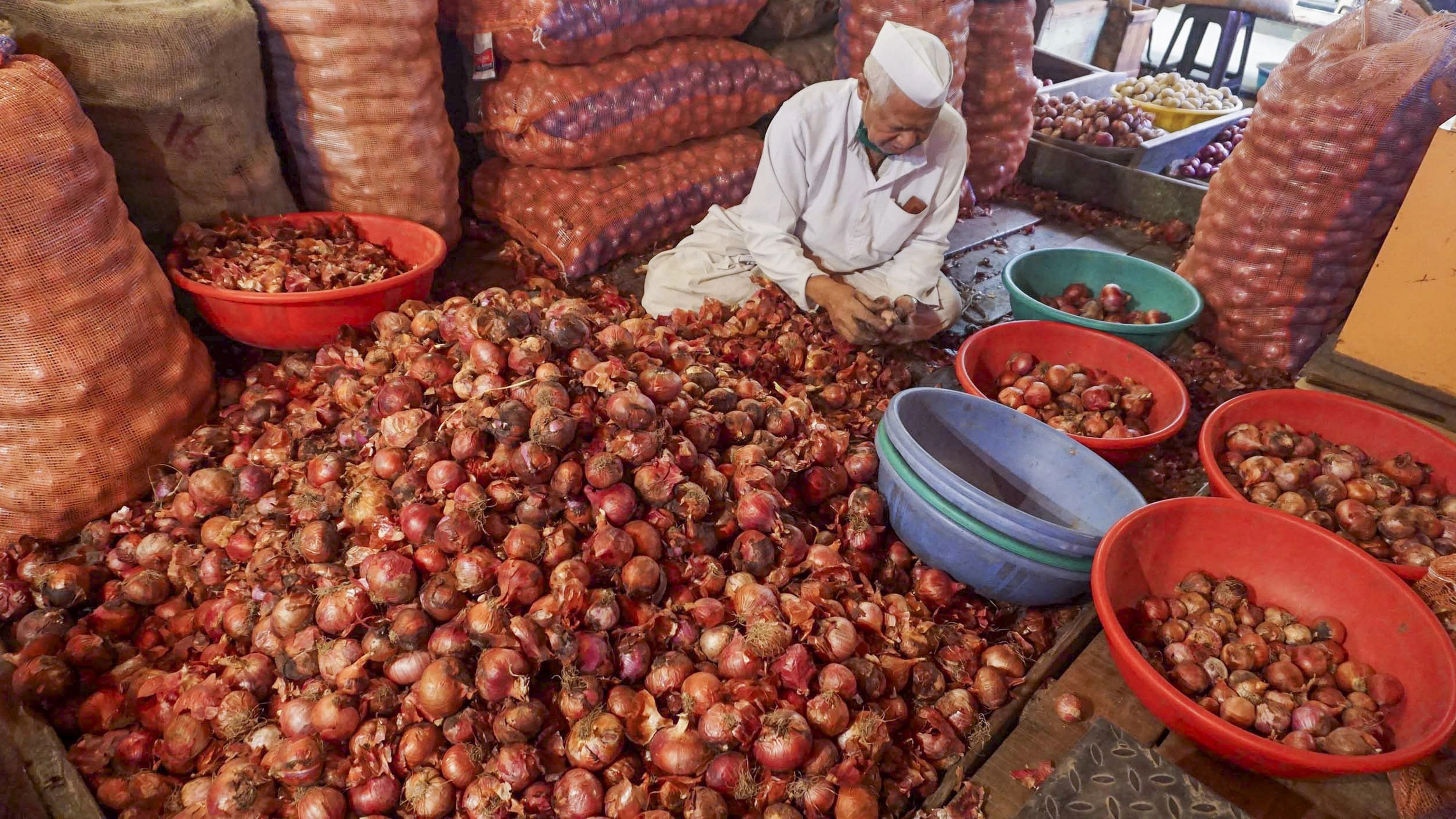 <div class="paragraphs"><p>A trader sells onions at a market, in Thane.  </p></div>