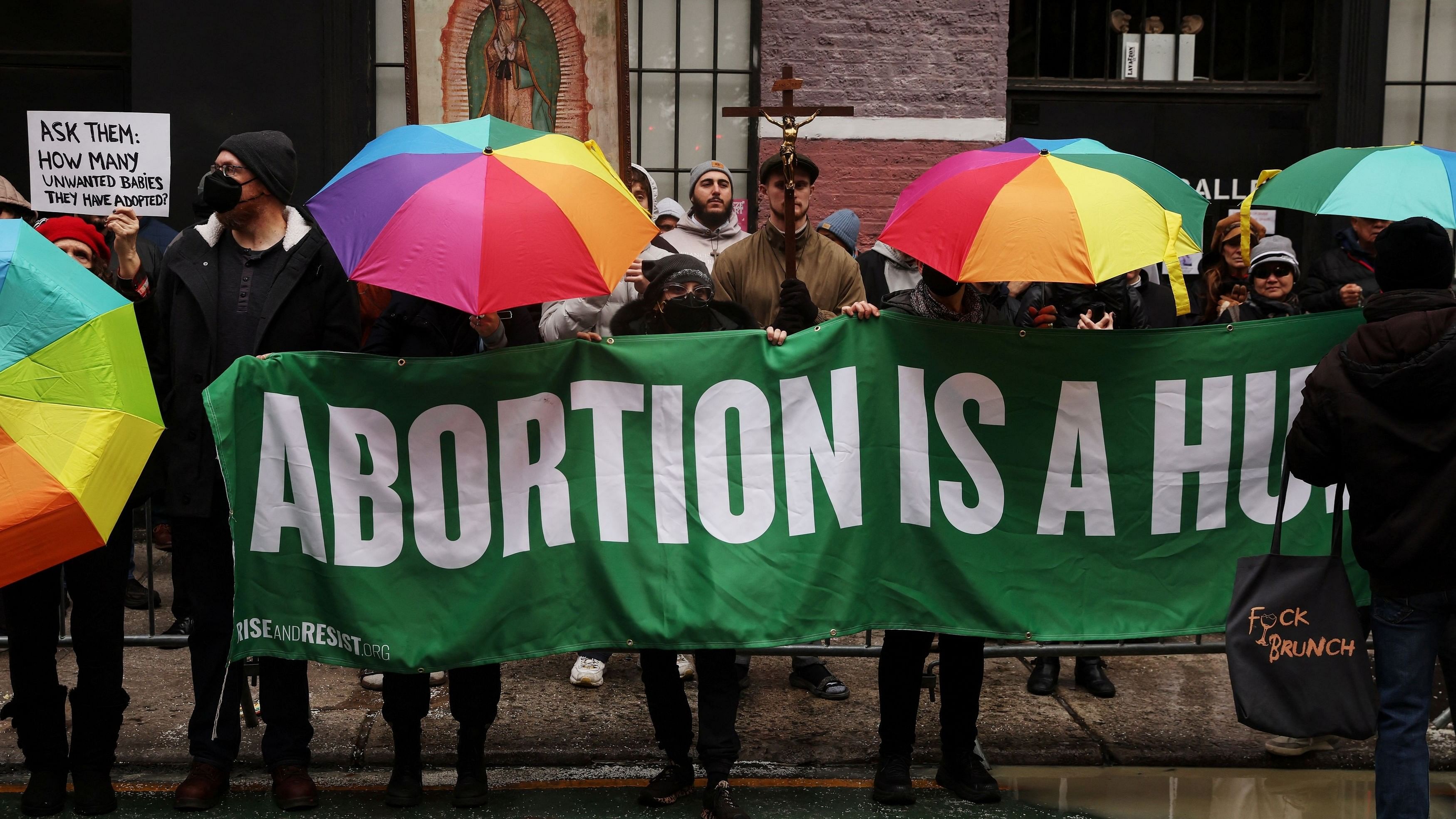 <div class="paragraphs"><p>Abortion rights activists stand in front of anti-abortion activists as they pray outside the Planned Parenthood Manhattan Health Center in New York City.&nbsp;</p></div>