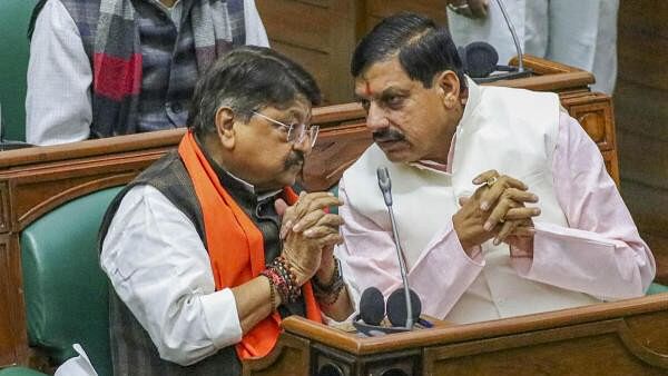 <div class="paragraphs"><p>Madhya Pradesh Chief Minister Mohan Yadav with BJP MLA Kailash Vijayvargiya during the Winter session of MP Assembly, in Bhopal, Tuesday, Dec. 19, 2023.</p></div>