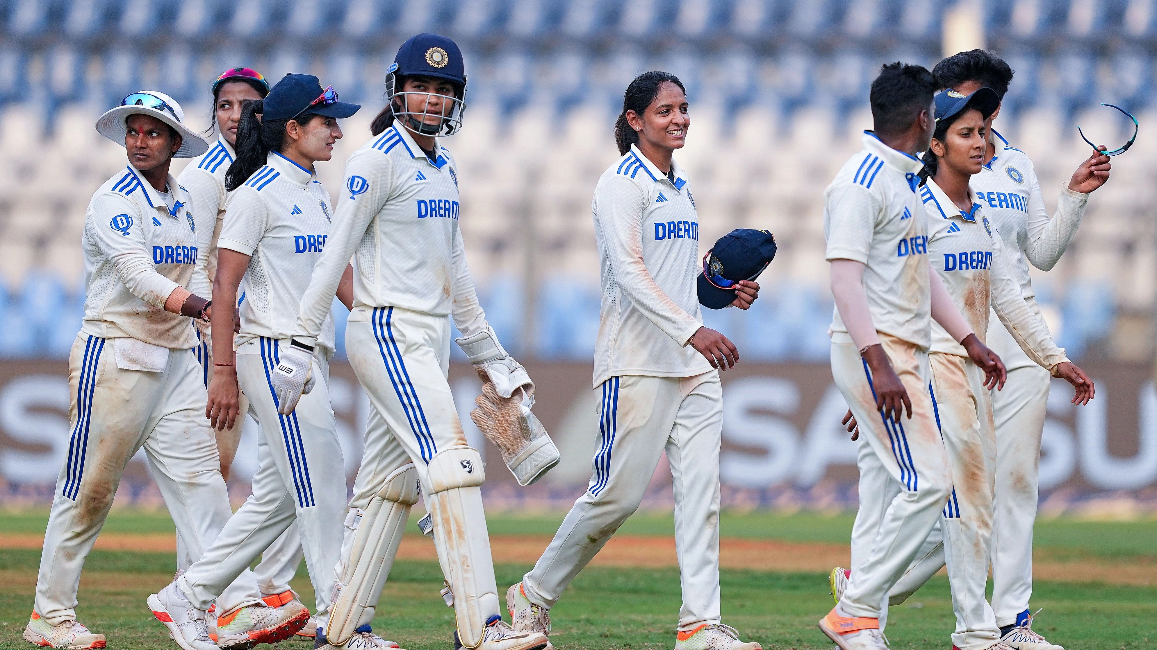 <div class="paragraphs"><p>Mumbai: India-Women's captain Harmanpreet Kaur returns to pavilion with teammates after the end of play on the third day of the one-off Test cricket match between India Women and Australia Women </p></div>