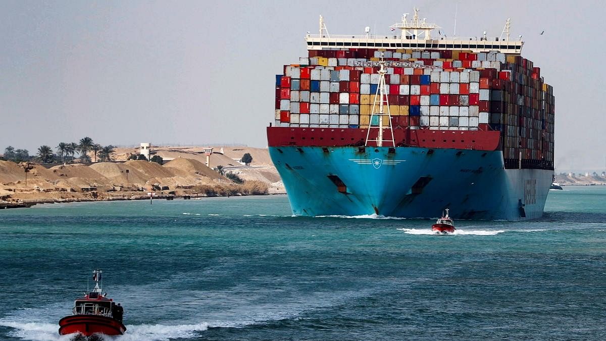 <div class="paragraphs"><p>A shipping container passes through the Suez Canal in Suez.</p></div>