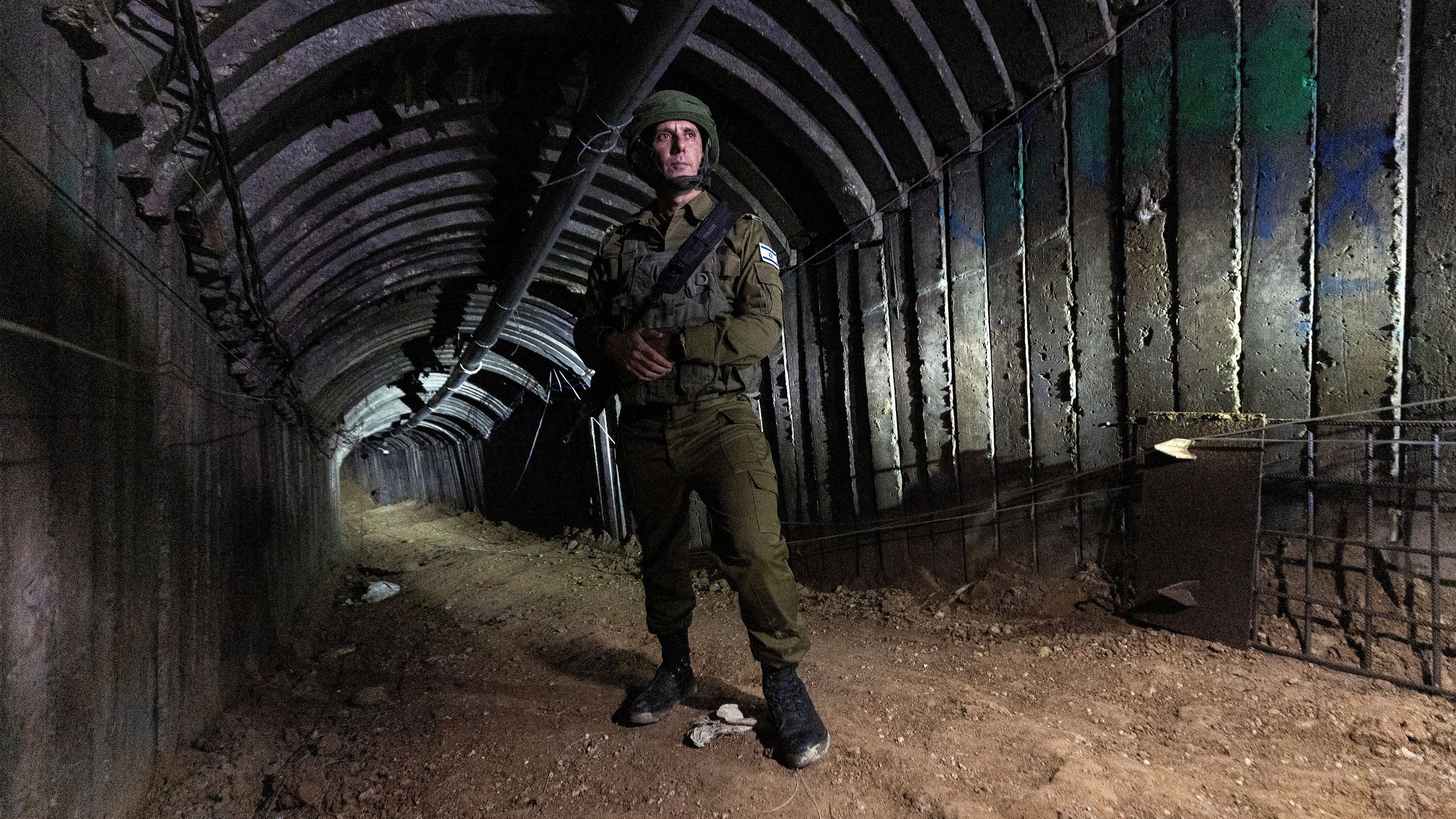 <div class="paragraphs"><p>Israeli military spokesperson Rear Admiral Daniel Hagari stands in what Israel's military says is an iron-girded tunnel designed by Hamas to disgorge carloads of Palestinian fighters for a surprise storming of the border, amid the Israeli army's ongoing ground operation against Palestinian Islamist group Hamas, close to Erez crossing in the northern Gaza Strip, December 15, 2023. </p></div>