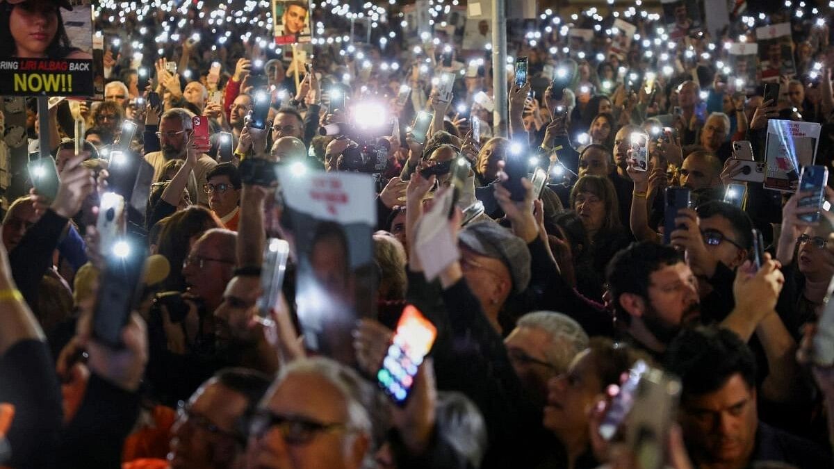 <div class="paragraphs"><p>Relatives and supporters of hostages kidnapped on the deadly October 7 attack by Palestinian Islamist group Hamas, hold up their phones with the lights on as they rally for their release, after a temporary truce between Israel and the Palestinian Islamist group Hamas expired, in Tel Aviv, Israel, December 2, 2023.</p></div>