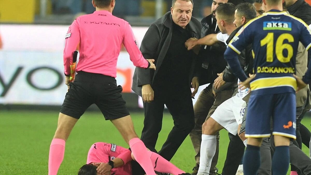 <div class="paragraphs"><p>MKE Ankaragucu President Faruk Koca reacts as the referee Halil Umut Meler lies on the ground at the end of their Super Lig home match against Caykur Rizespor.</p></div>