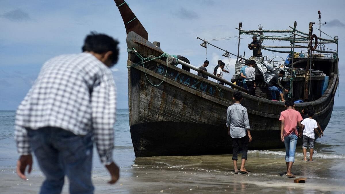 <div class="paragraphs"><p>File photo of a wooden boat, that carried Rohingya Muslims that docked in Indonesia.</p></div>