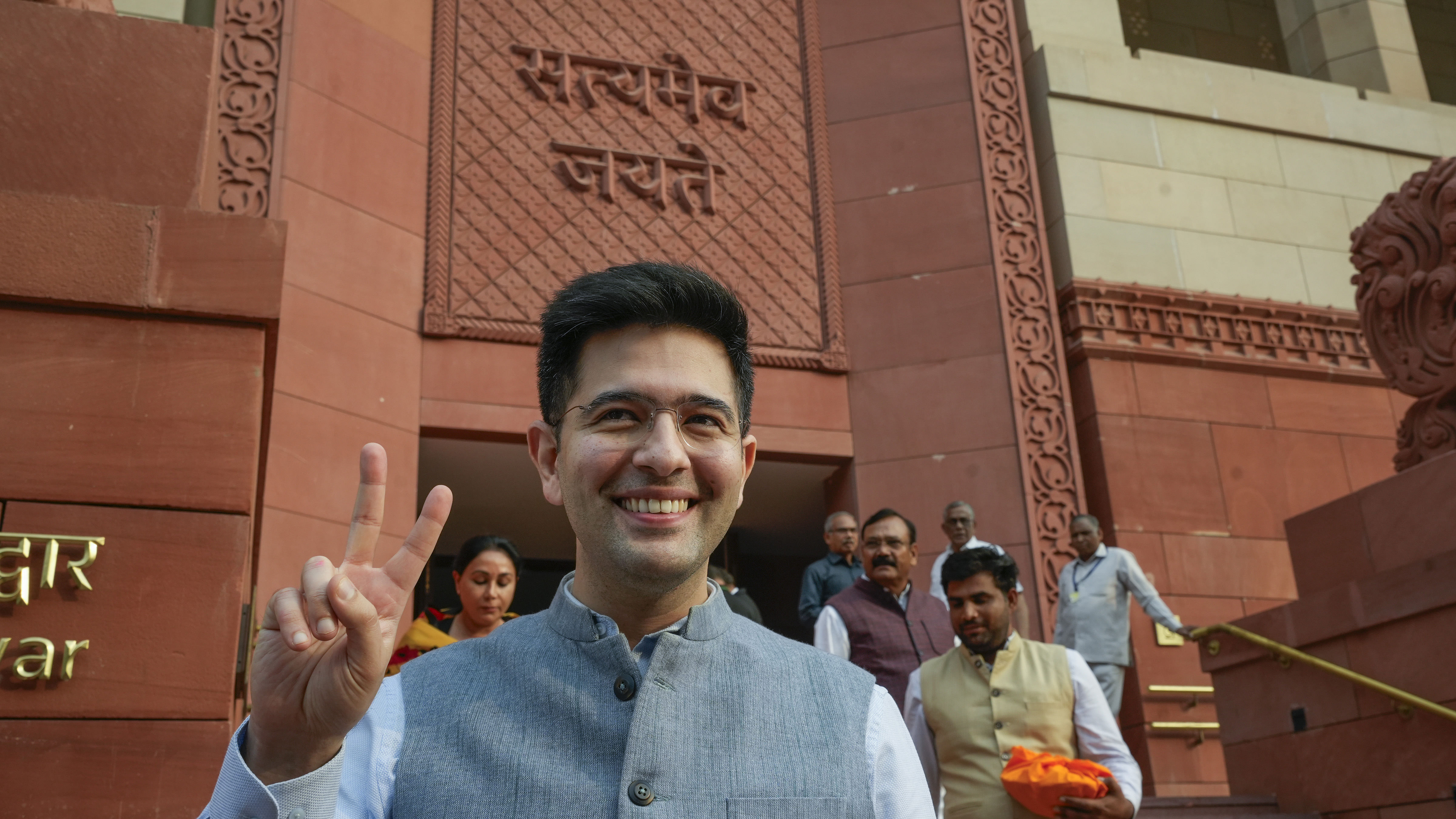 <div class="paragraphs"><p>AAP MP Raghav Chadha flashes the victory sign after his suspension was revoked by Rajya Sabha Chairman Jagdeep Dhankhar</p></div>