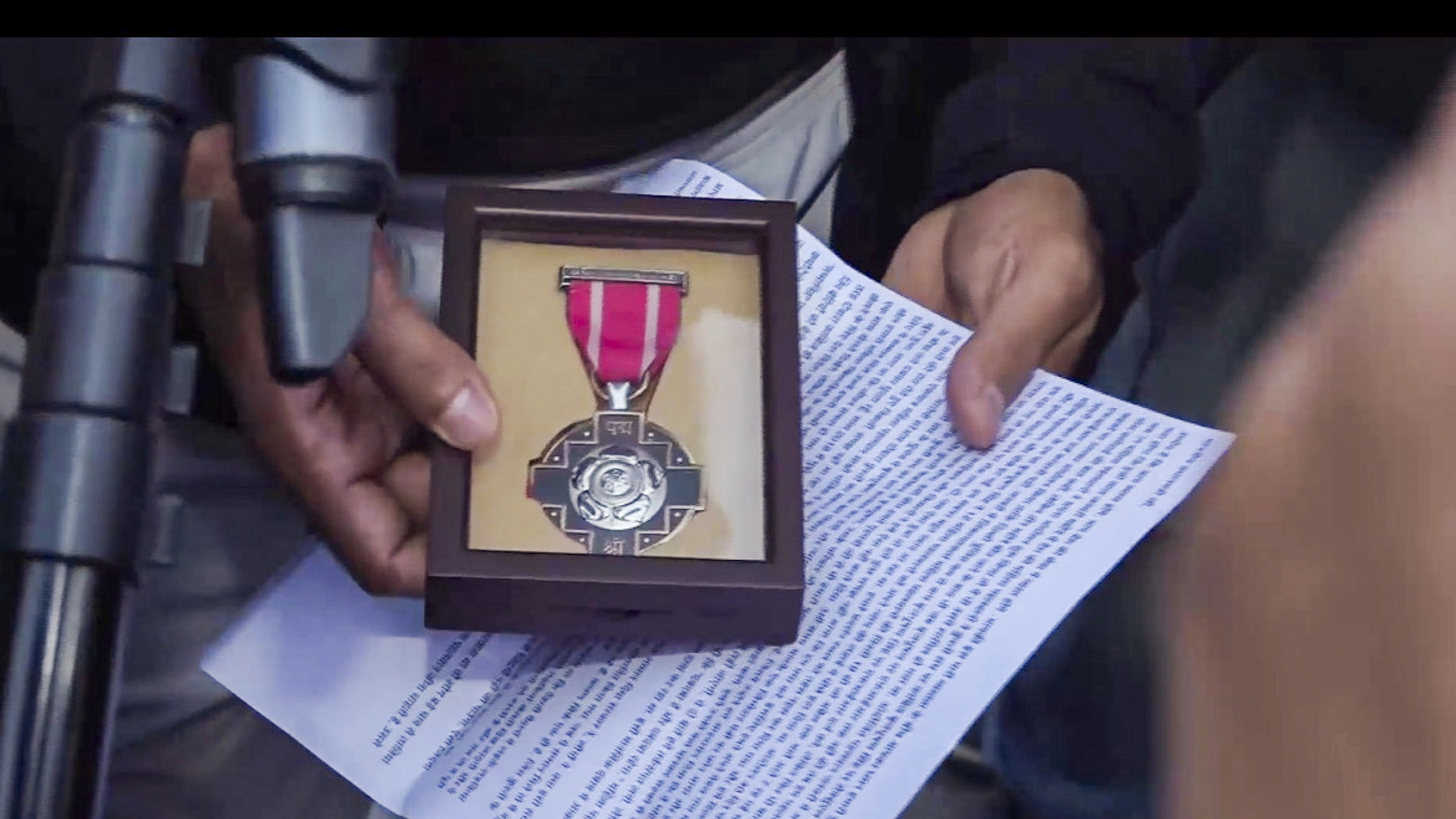 <div class="paragraphs"><p>Wrestler Bajrang Punia holds his Padma Shri award near the Kartavya Path, in New Delhi.</p></div>