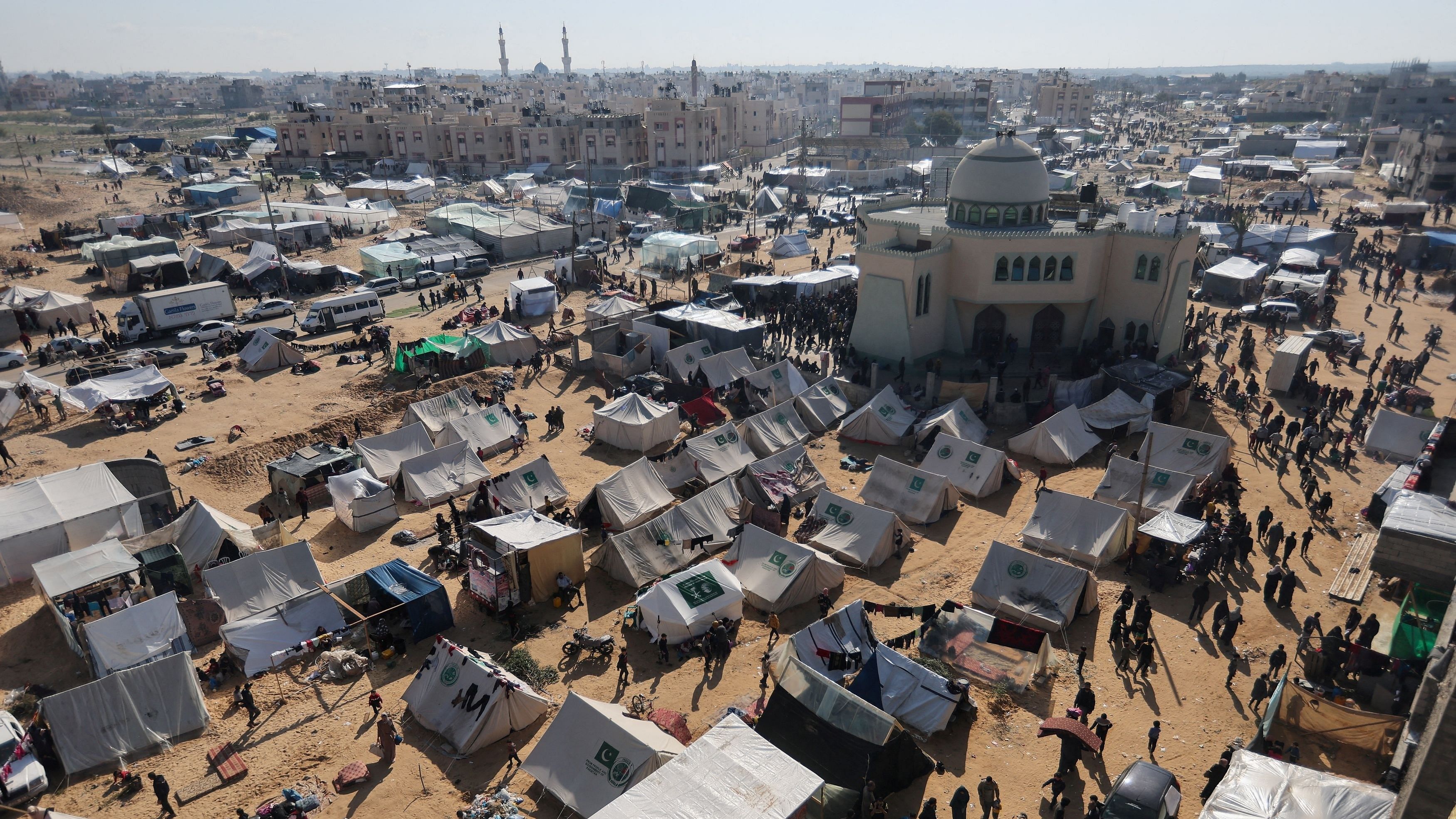 <div class="paragraphs"><p>Displaced Palestinians, who fled their houses due to Israeli strike, shelter in a camp in Rafah, amid the ongoing conflict between Israel and Palestinian Islamist group Hamas, in the southern Gaza Strip, December 6, 2023. </p></div>