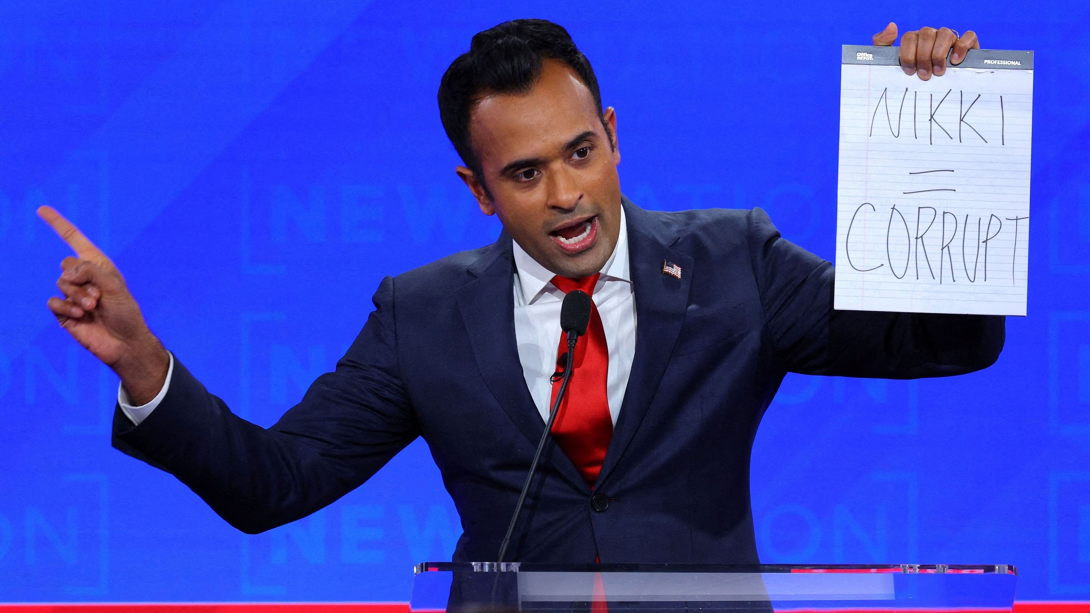 <div class="paragraphs"><p>Republican presidential candidate and businessman Vivek Ramaswamy holds up a handwritten sign referring to fellow candidate and former U.S. Ambassador to the United Nations Nikki Haley.</p></div>