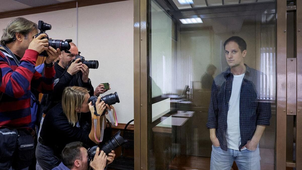 <div class="paragraphs"><p>Wall Street Journal reporter Evan Gershkovich stands inside an enclosure for defendants before a court hearing to consider an appeal against his pre-trial detention on espionage charges in Moscow, Russia.</p></div>