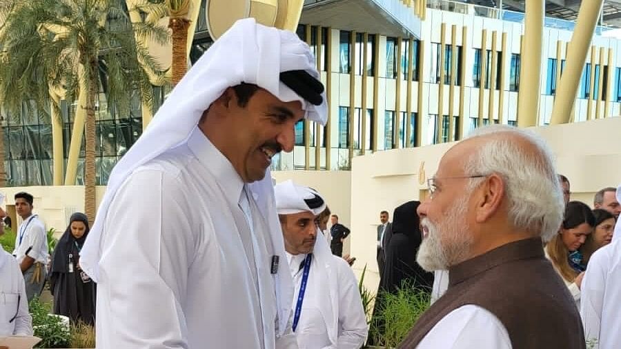 <div class="paragraphs"><p>PM Narendra Modi with Qatar's Amir Sheikh Tamim bin Hamad Al-Thani.</p></div>