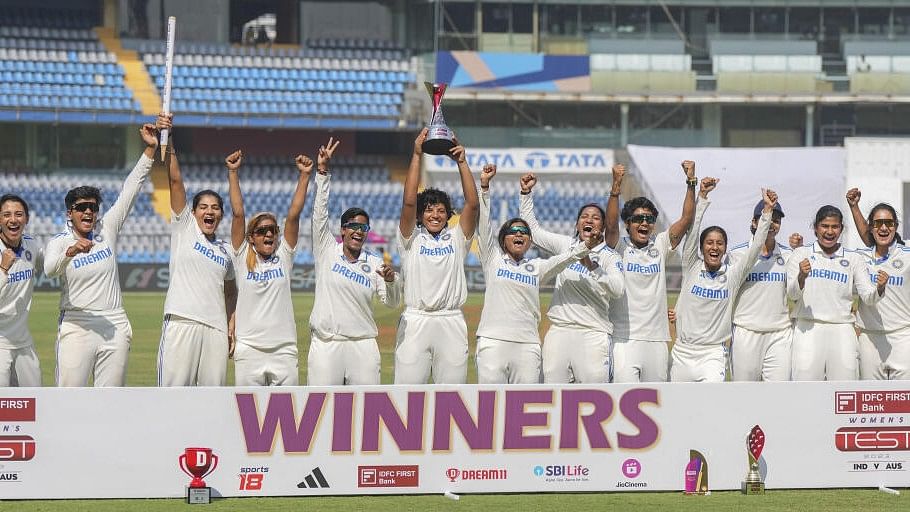<div class="paragraphs"><p>Indian players pose with the trophy after winning the one-off Test cricket match against Australia, in Mumbai.</p></div>