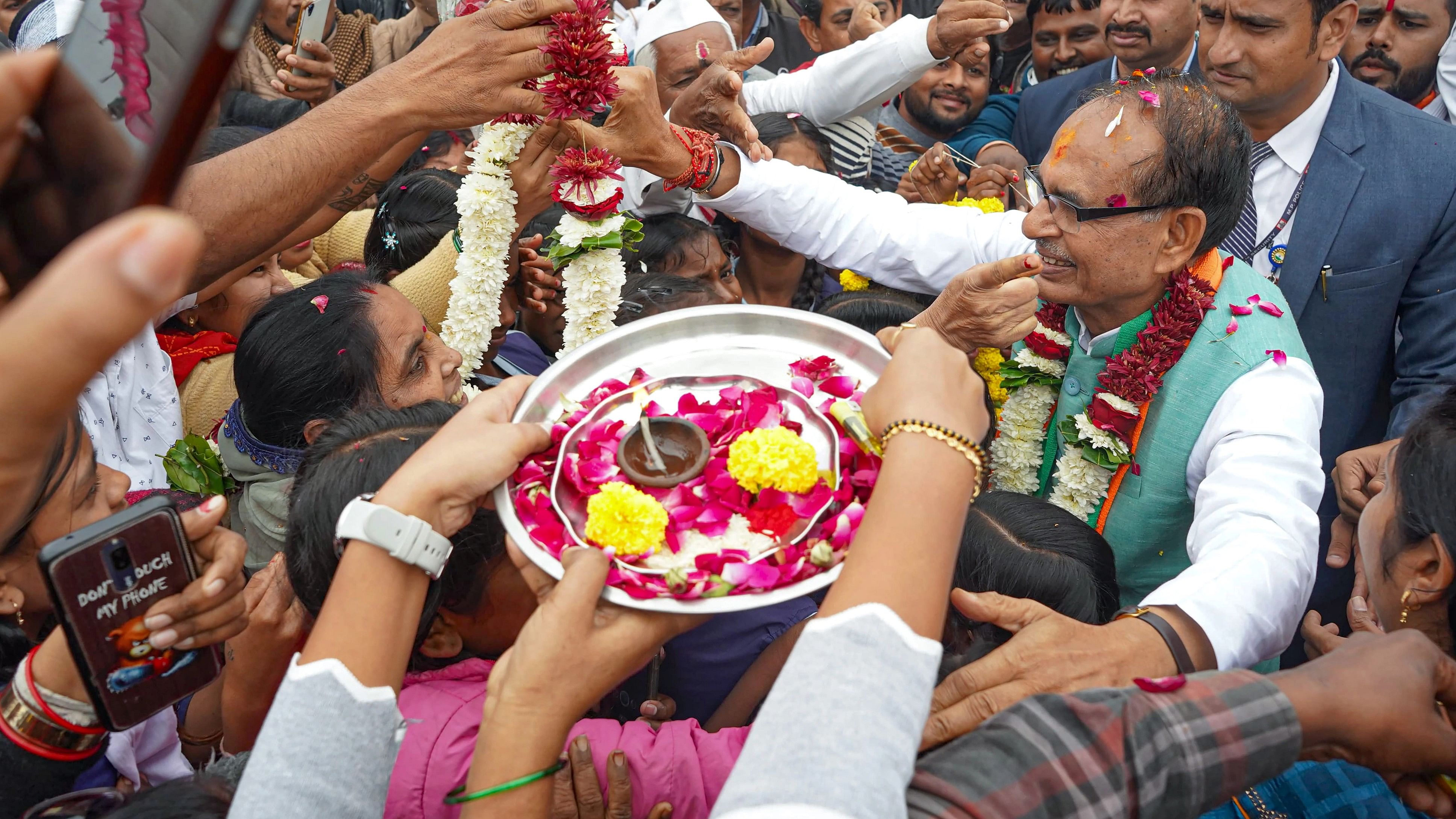 <div class="paragraphs"><p>Madhya Pradesh Chief Minister Shivraj Singh Chouhan being greeted by supporters during his visit to Chhindwara district, Wednesday, Dec. 6, 2023. </p></div>