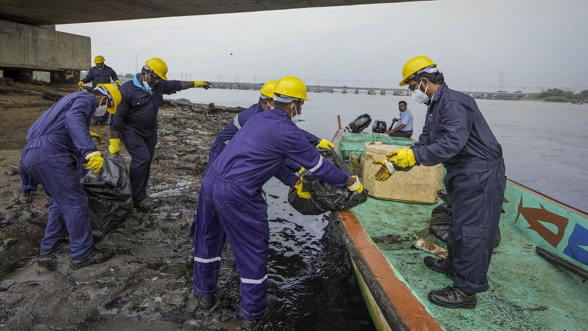 <div class="paragraphs"><p>Rescue officials clean after an oil spill in the Bay of Bengal off the Ennore Creek area in the aftermath of Cyclone Michaung, in Chennai, Friday, Dec. 15, 2023.</p></div>