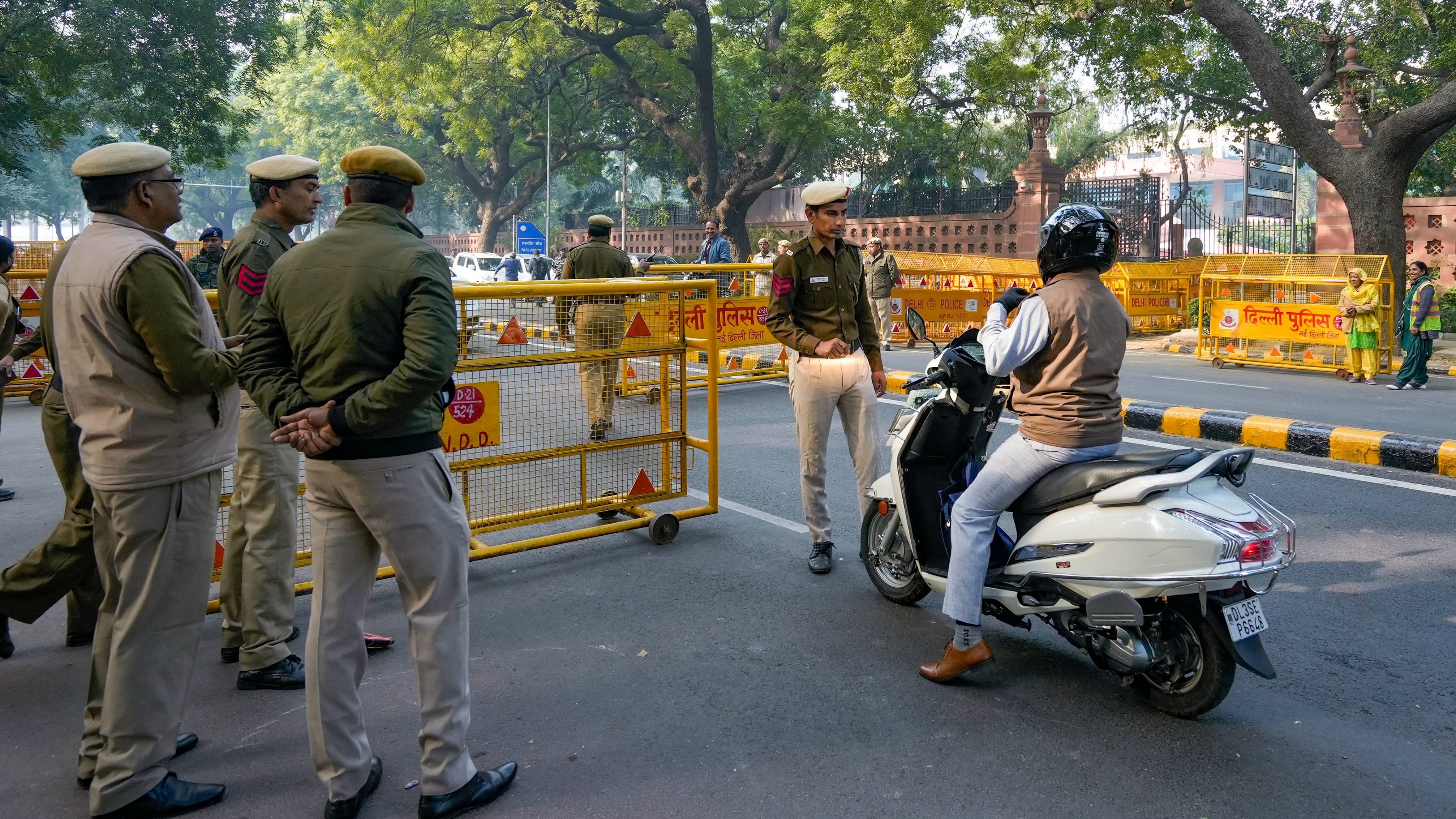 <div class="paragraphs"><p>Security personnel stops and checks vehicles near the Parliament House after a security breach on the anniversary of the 2001 Parliament terror attack on Wednesday, in New Delhi, December 14, 2023. </p></div>