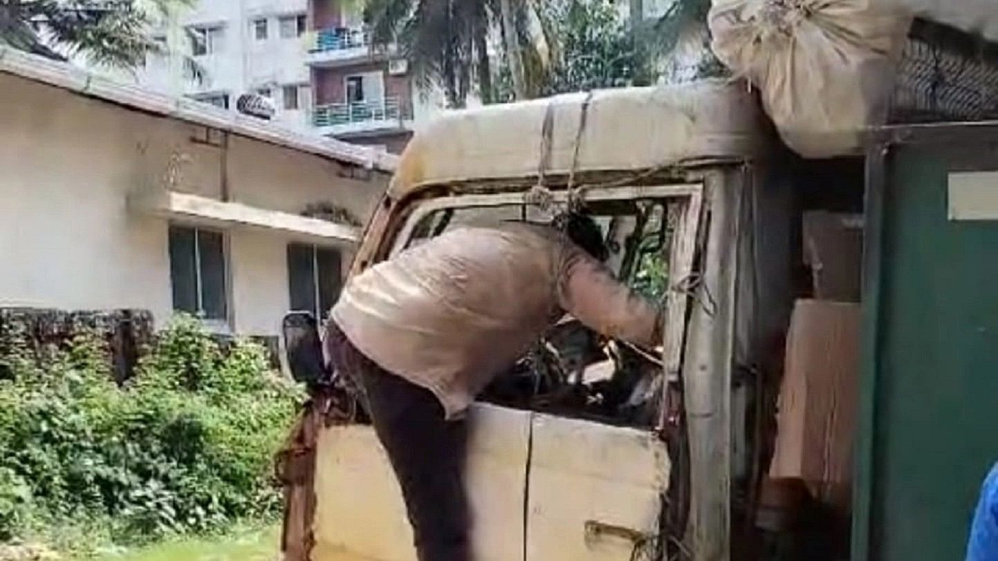 <div class="paragraphs"><p>Video grab of a driver of a waste collection vehicle entering through the window.</p></div>