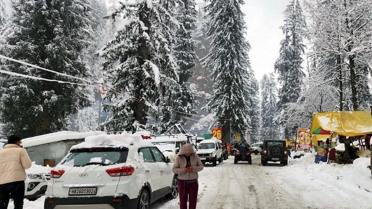 <div class="paragraphs"><p>Vehicles covered in snow after a snowfall, near Atal Tunnel in Manali.</p></div>