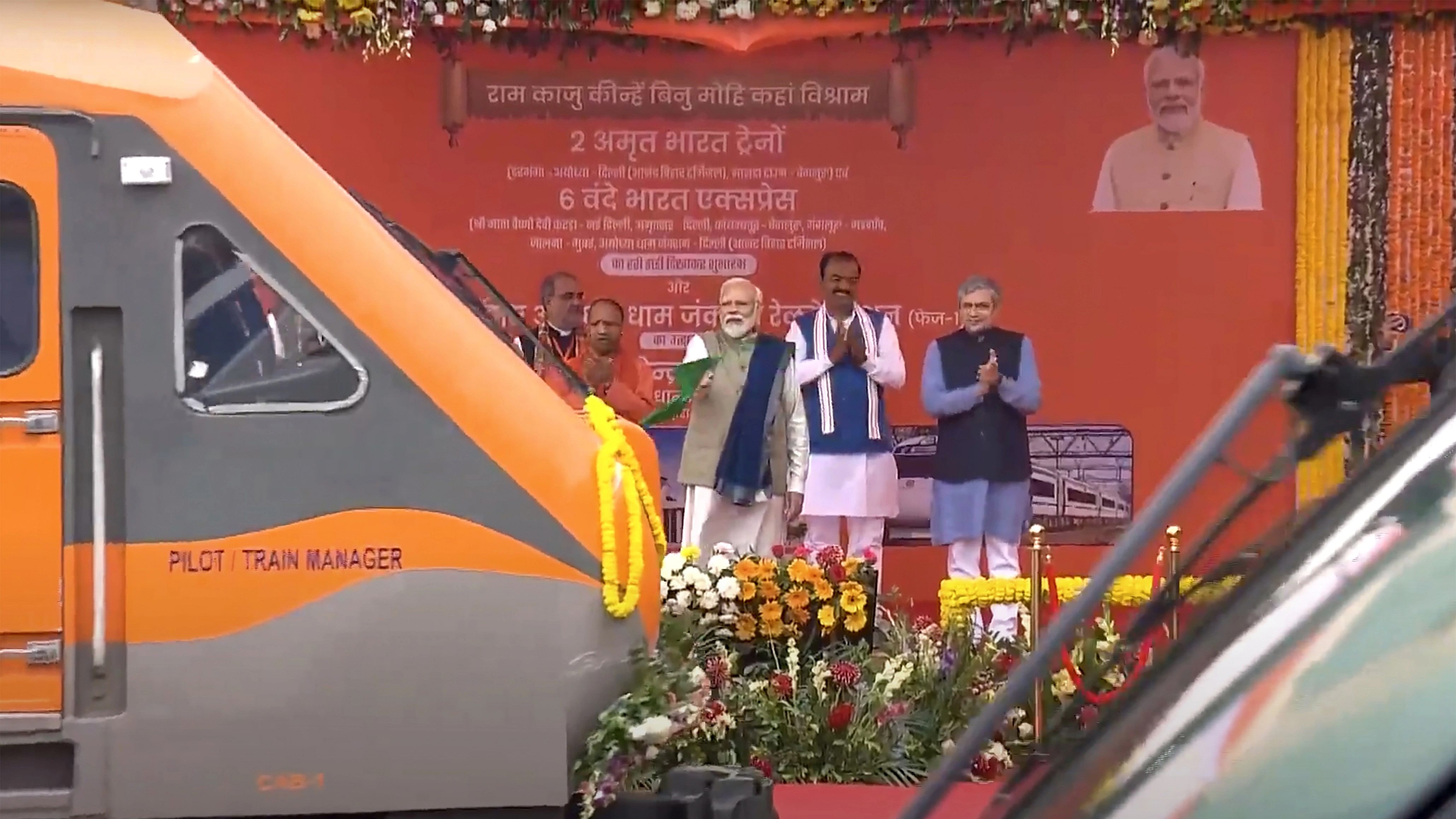 <div class="paragraphs"><p>Prime Minister Narendra Modi flags off a train during the inauguration of redeveloped Ayodhya Dham Station, in Ayodhya, Saturday, Dec. 30, 2023. Uttar Pradesh Chief Minister Yogi Adityanath, Deputy Chief Minister Keshav Prasad Maurya and Union Railways Minister Ashwini Vaishnaw are also seen.</p></div>