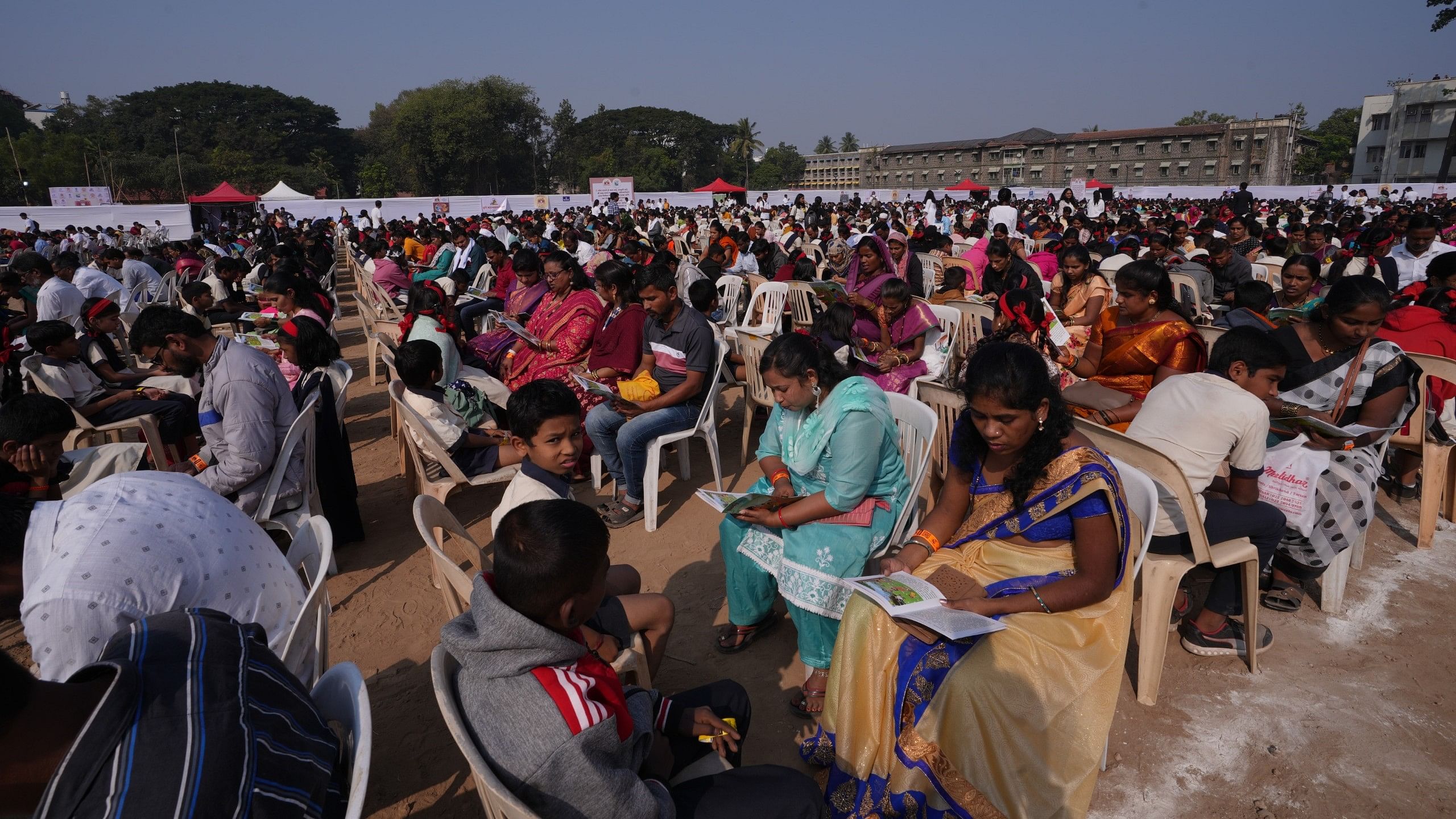 <div class="paragraphs"><p>Parents reading to their children at the Pune Book Festival.</p></div>