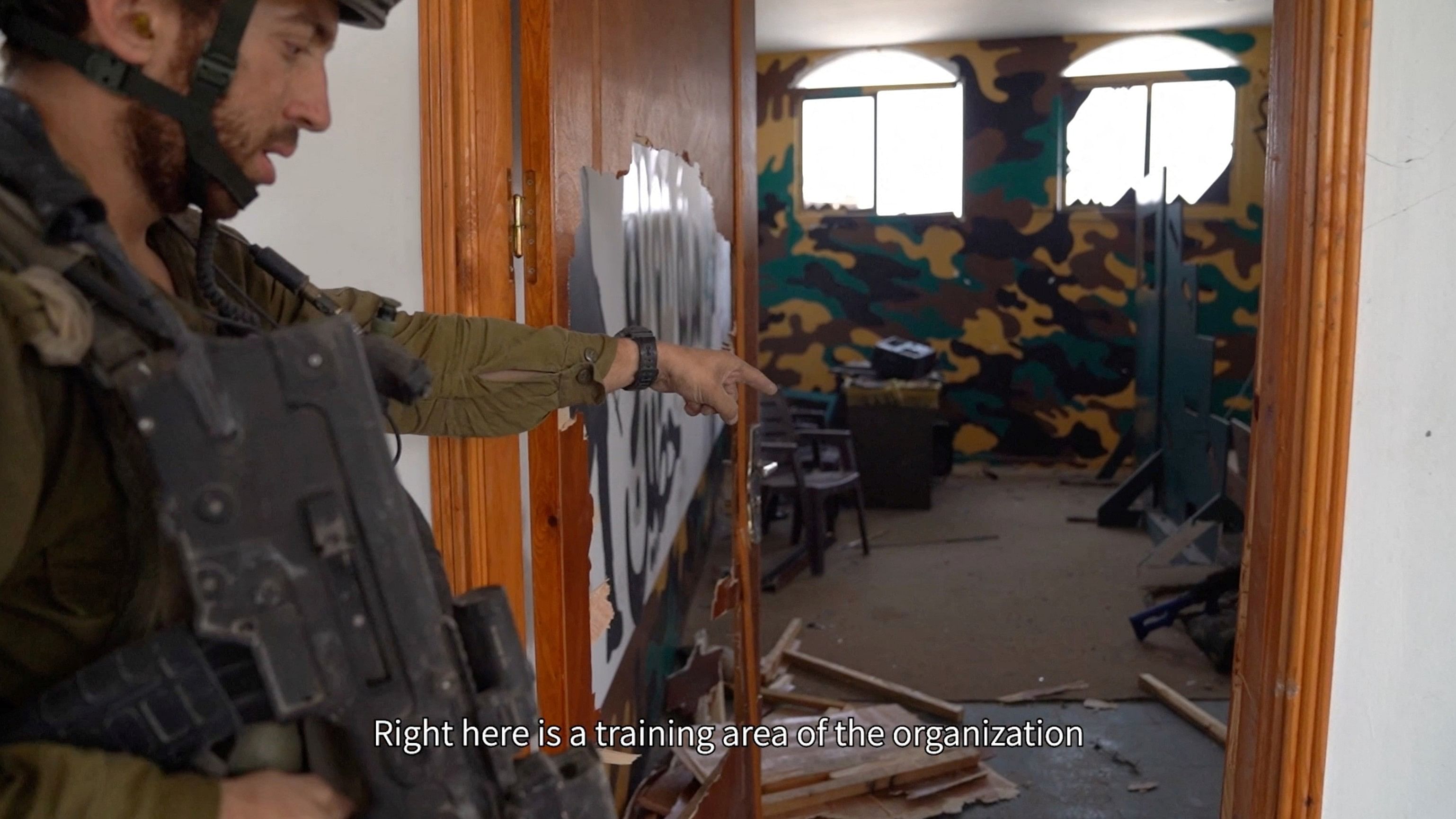 <div class="paragraphs"><p>An Israeli soldier points to what the Israeli army says it is a training area, inside a mosque in Jabalia, in the northern Gaza Strip, in this screengrab taken from video released on December 11.</p></div>