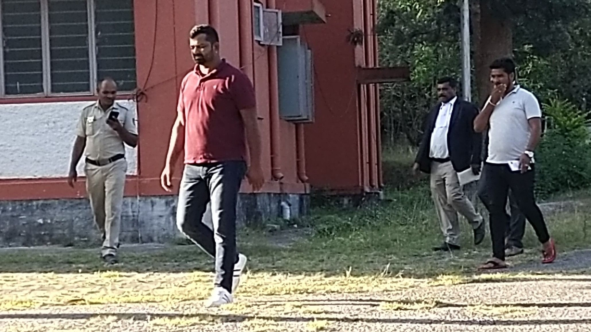 <div class="paragraphs"><p>Vikram Simha walks out of the senior civil judge’s residence after he was granted bail in a tree-felling case, in Belur of Hassan district on Sunday.</p></div>