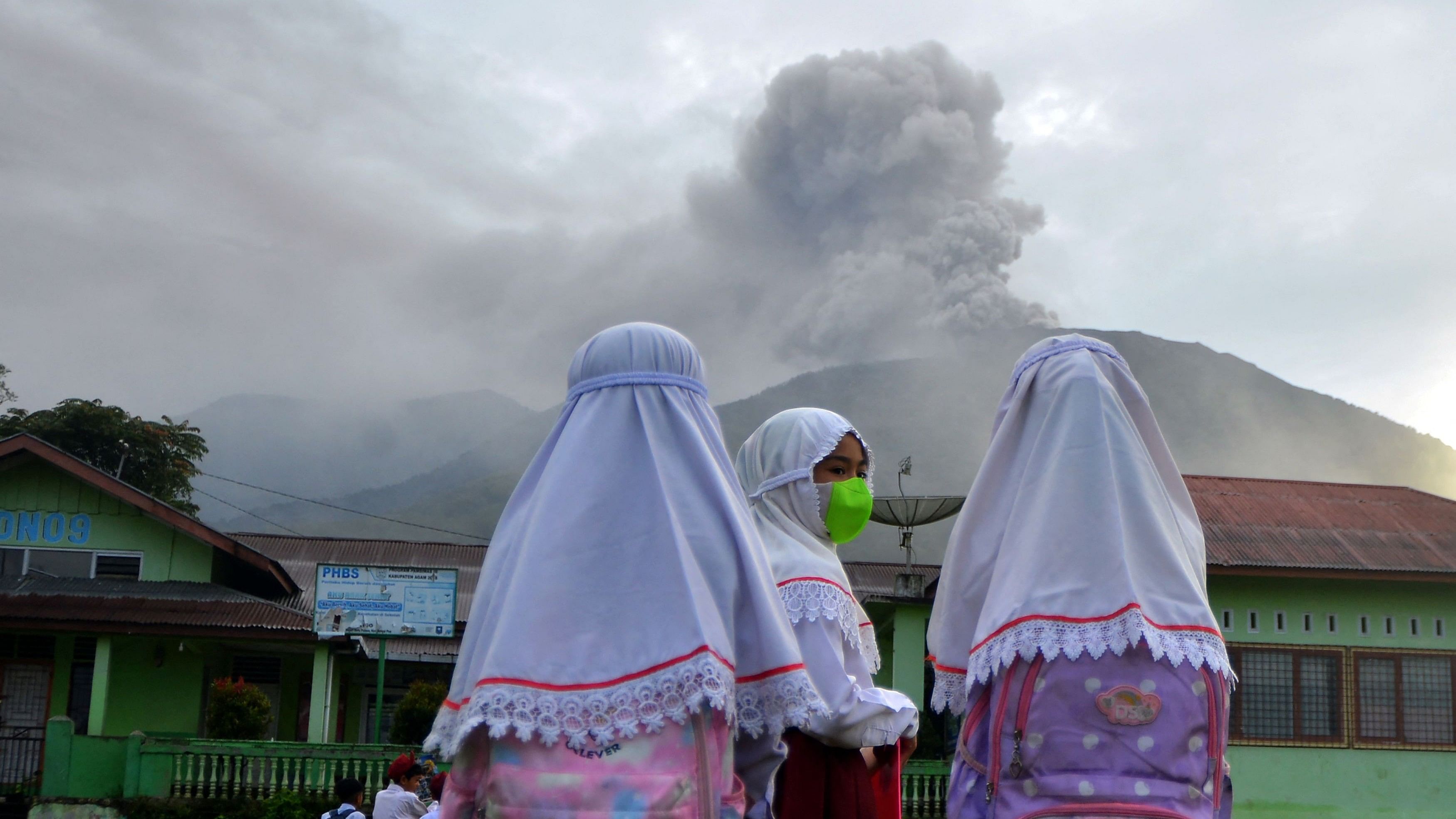 <div class="paragraphs"><p>Students are seen at school as Mount Marapi volcano spews volcanic ash as seen from Nagari Batu Palano in Agam, West Sumatra province, Indonesia, December 4, 2023, in this photo taken by Antara Foto.</p></div>