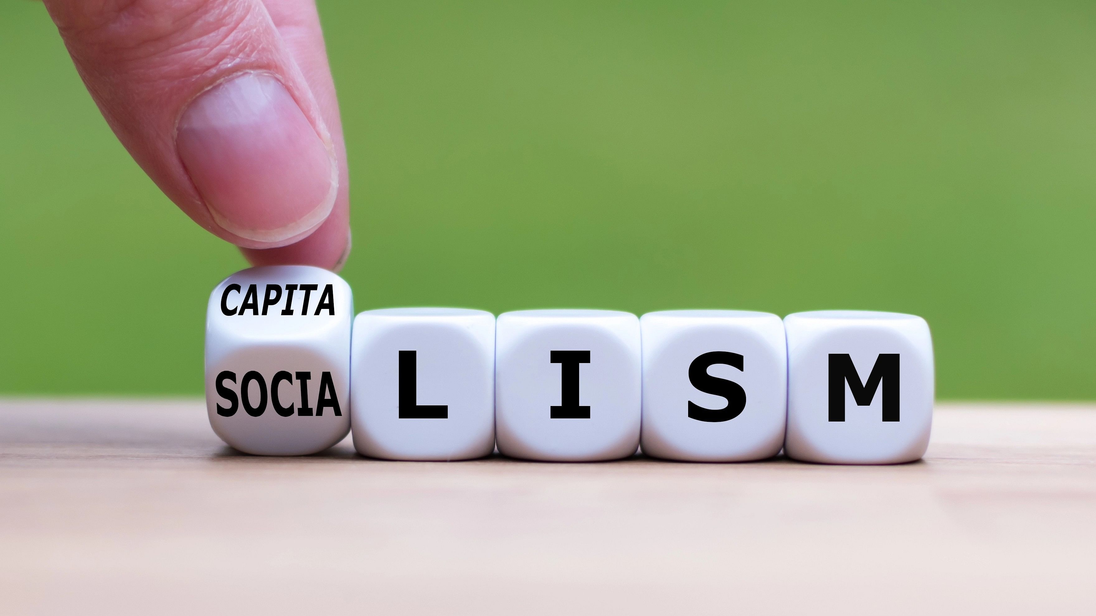 <div class="paragraphs"><p>Representative image showing a hand flipping a dice and changing the word 'Socialism' to 'Capitalism', or vice versa.</p></div>